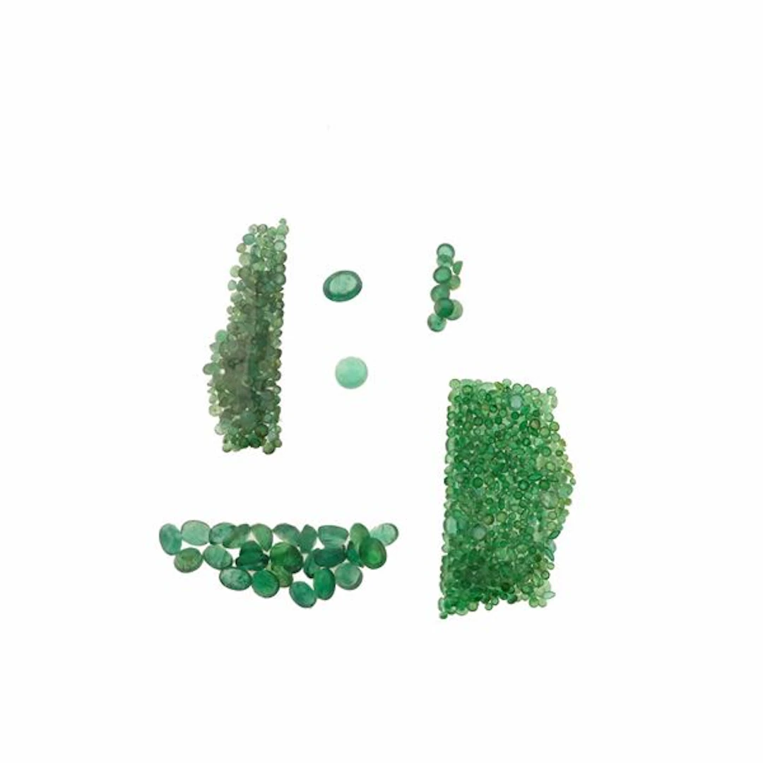 Collection of unmounted emeralds, of various shapes and treatments