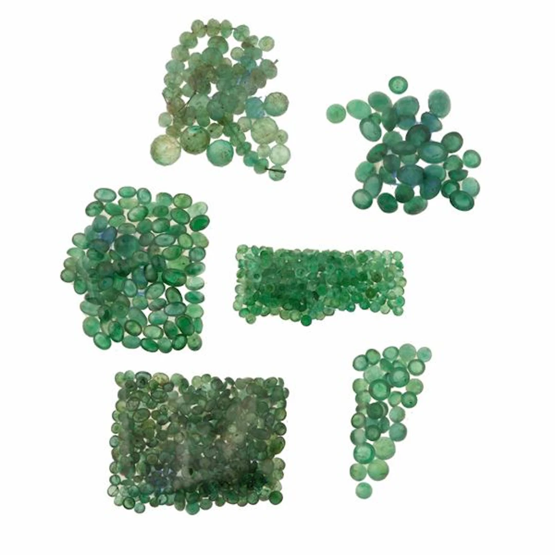 Collection of unmounted emeralds, of various shapes and treatments