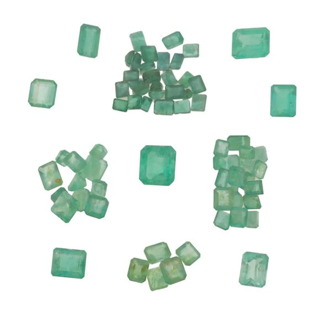 Collection of unmounted emeralds, of various shapes and treatments