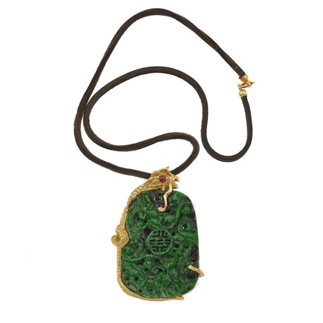 Carved jadeite and gold pendant