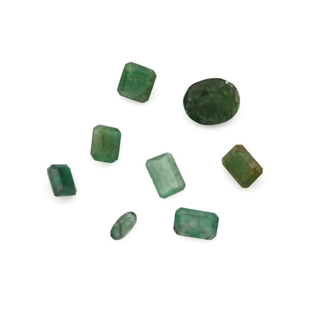 Collection of unmounted emeralds, of various shapes and treatments