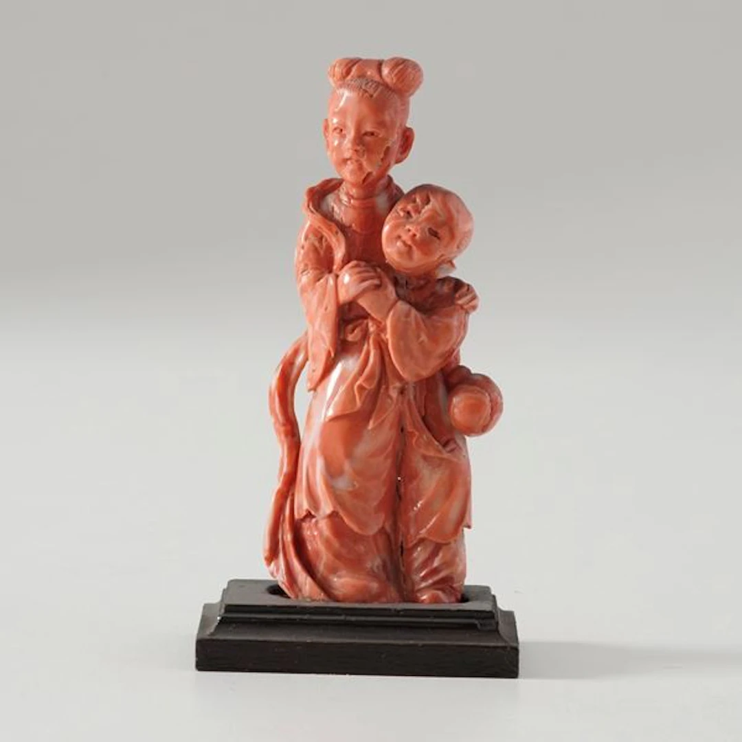 Small coral figure of a woman with a child