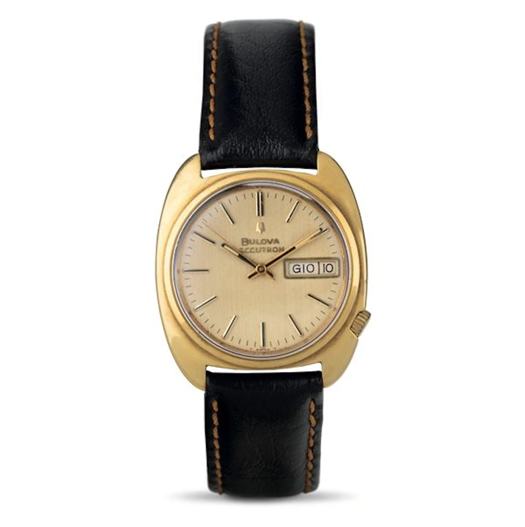 Accutron tonneau in oro giallo 18k, quadrante champagne con datario