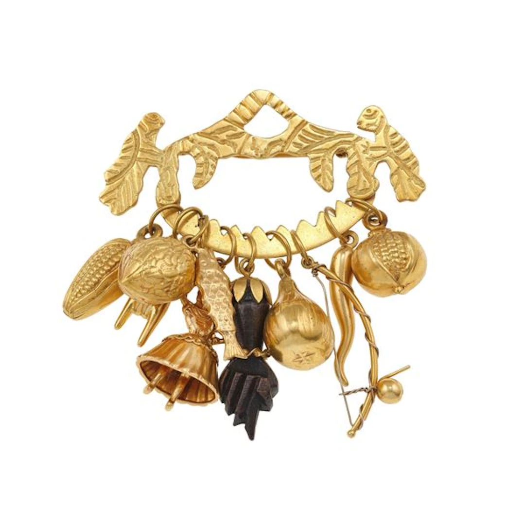 Gold brooch with charms