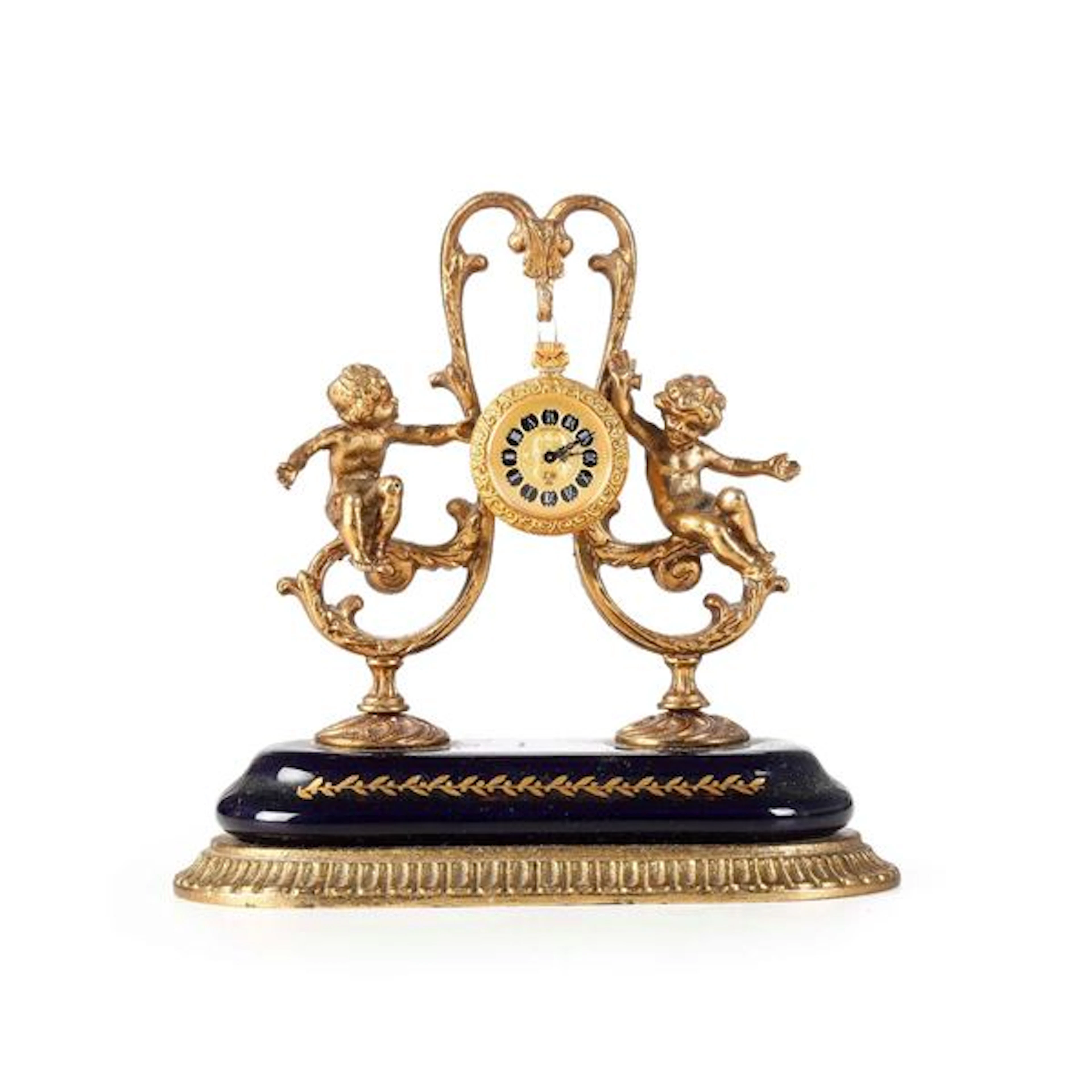Orologio in metallo dorato e smalti. XX secolo