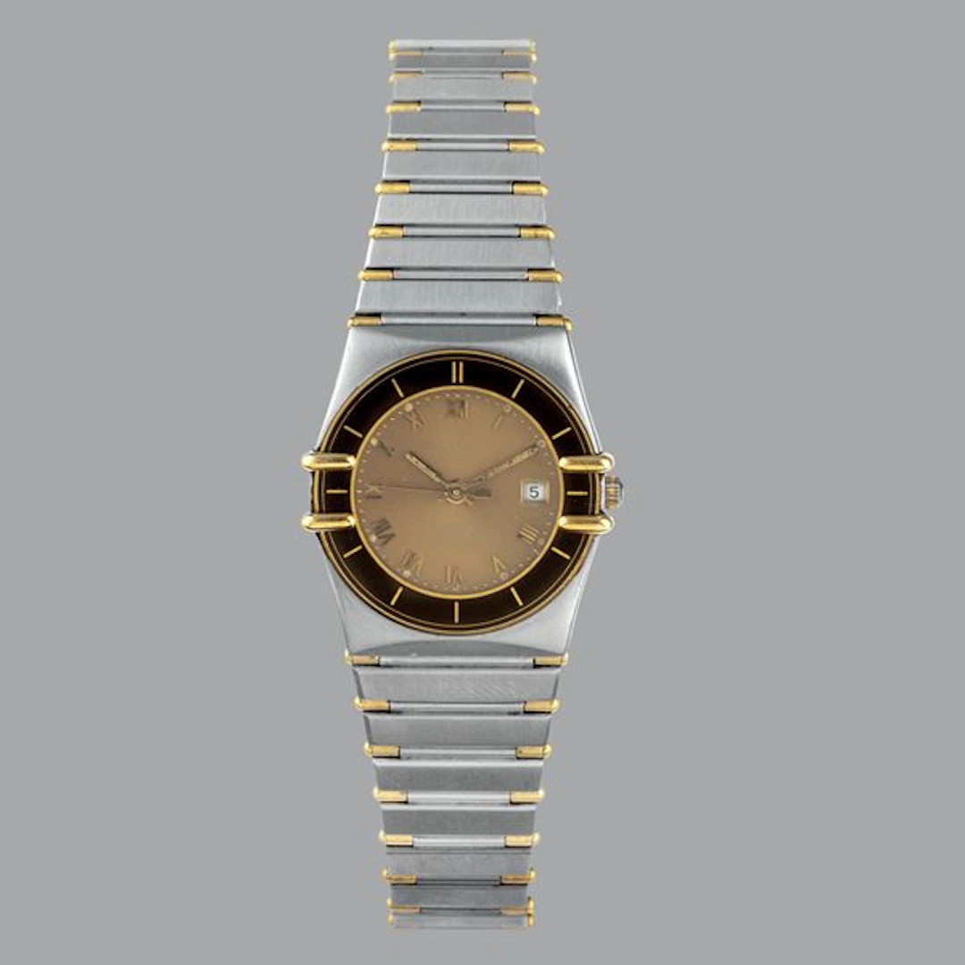 Constellation in acciaio con inserti dorati e bracciale integrato