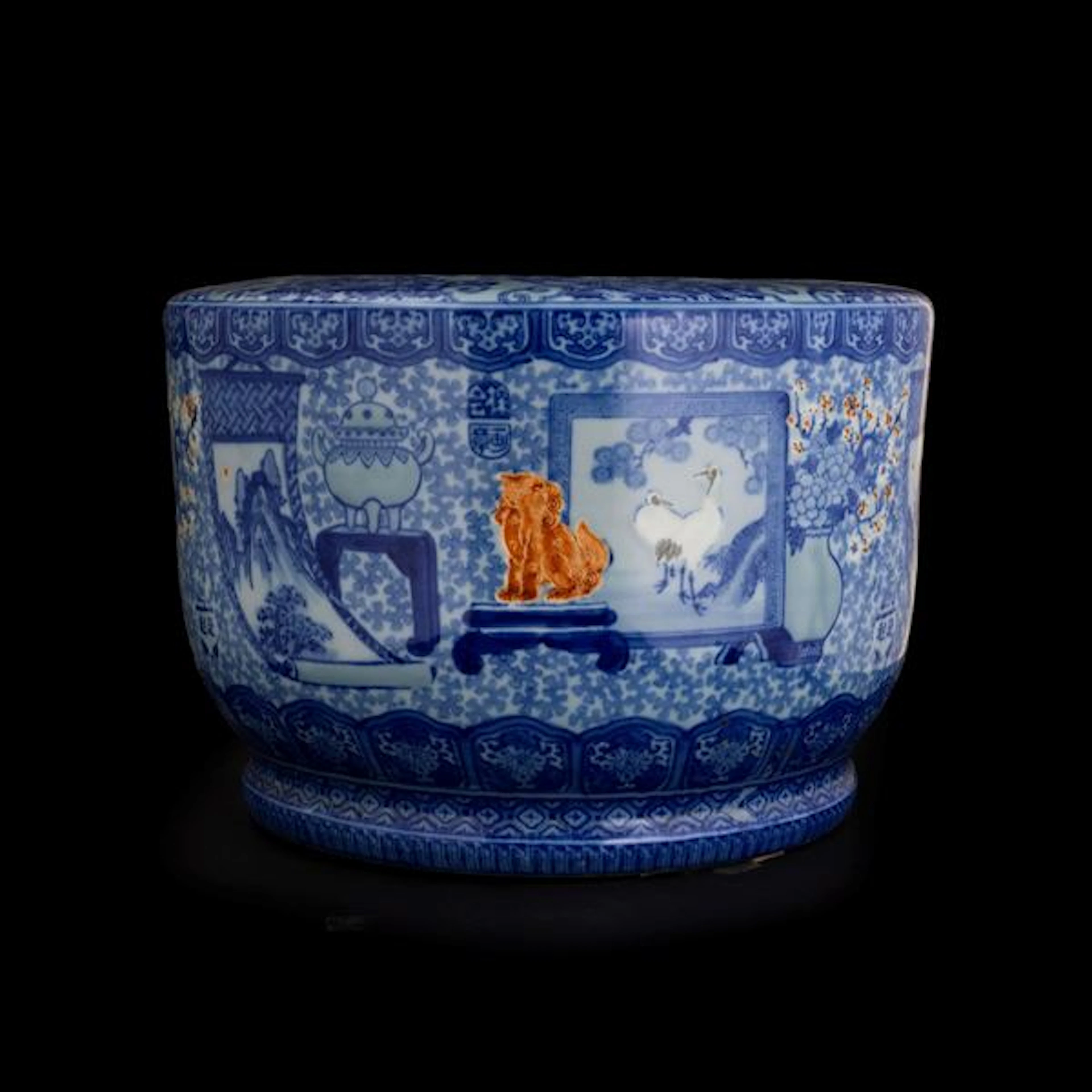 Cachepot in porcellana bianca e blu con scene paesaggistiche entro