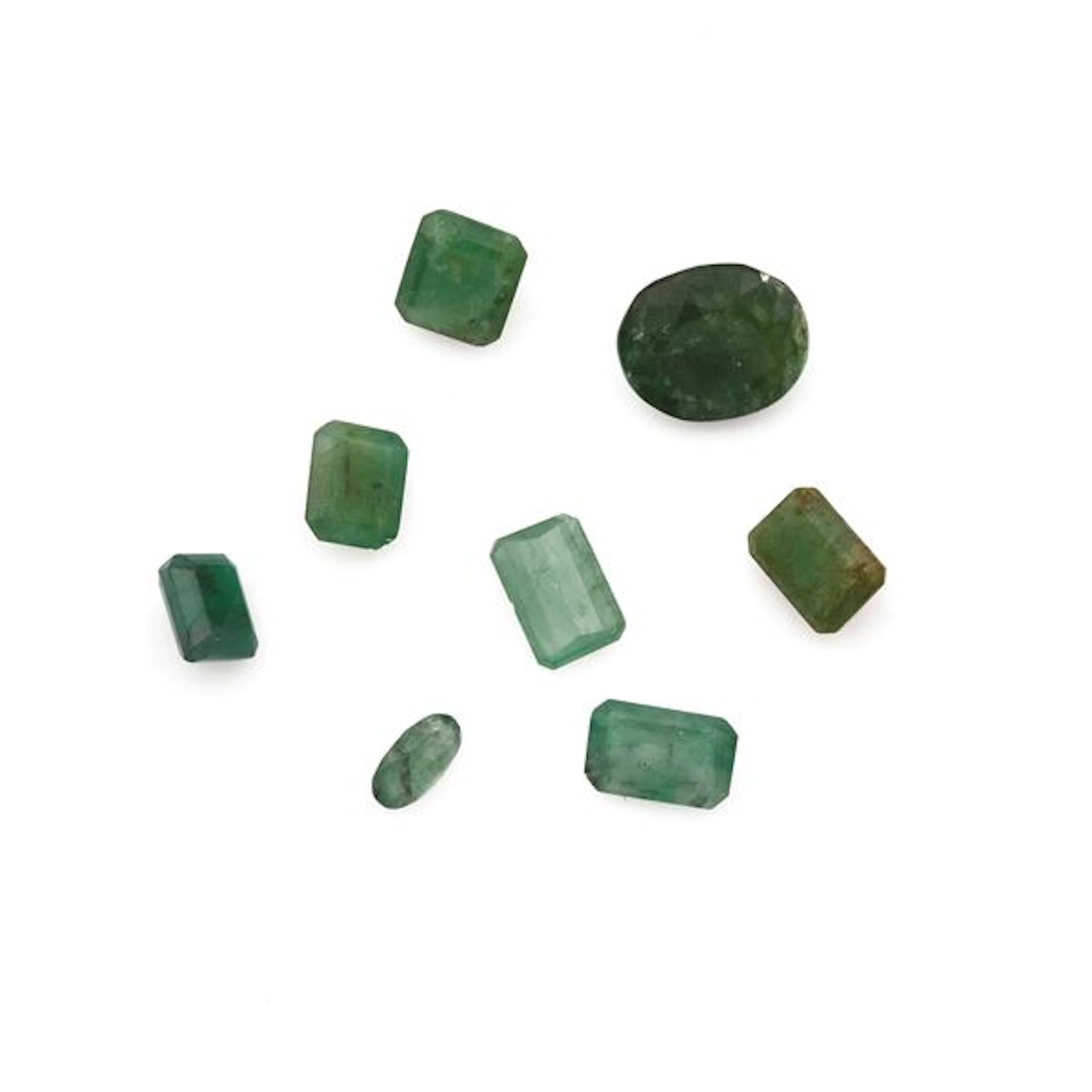 Collection of unmounted emeralds, of various shapes and treatments
