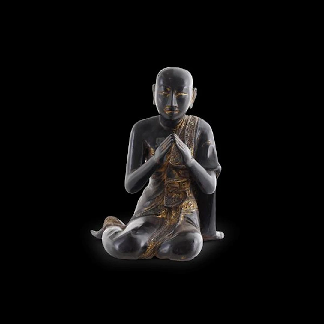 Figura in legno ebanizzato con tracce di doratura raffigurante saggio