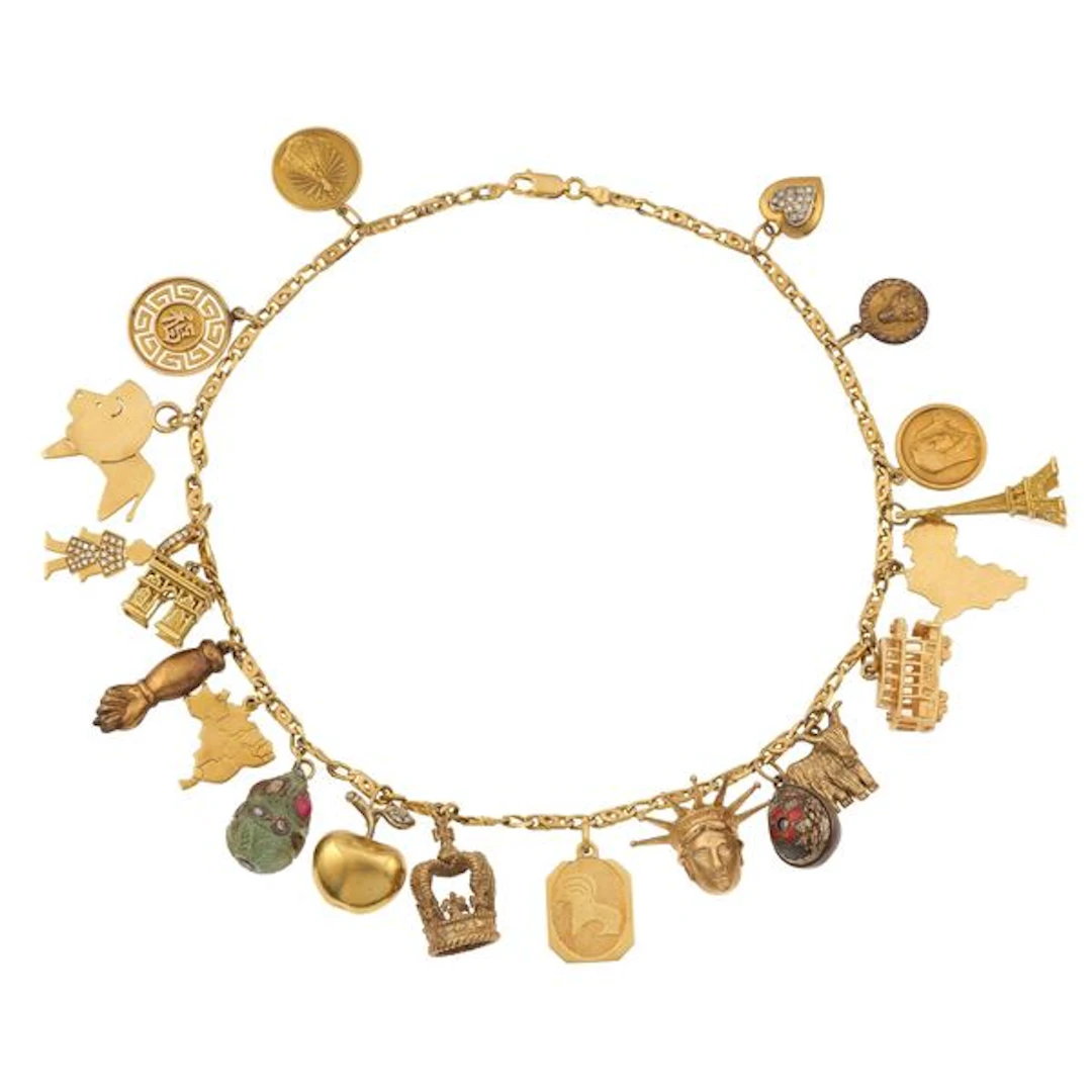 Gold, low-karat gold and metal necklace with charms