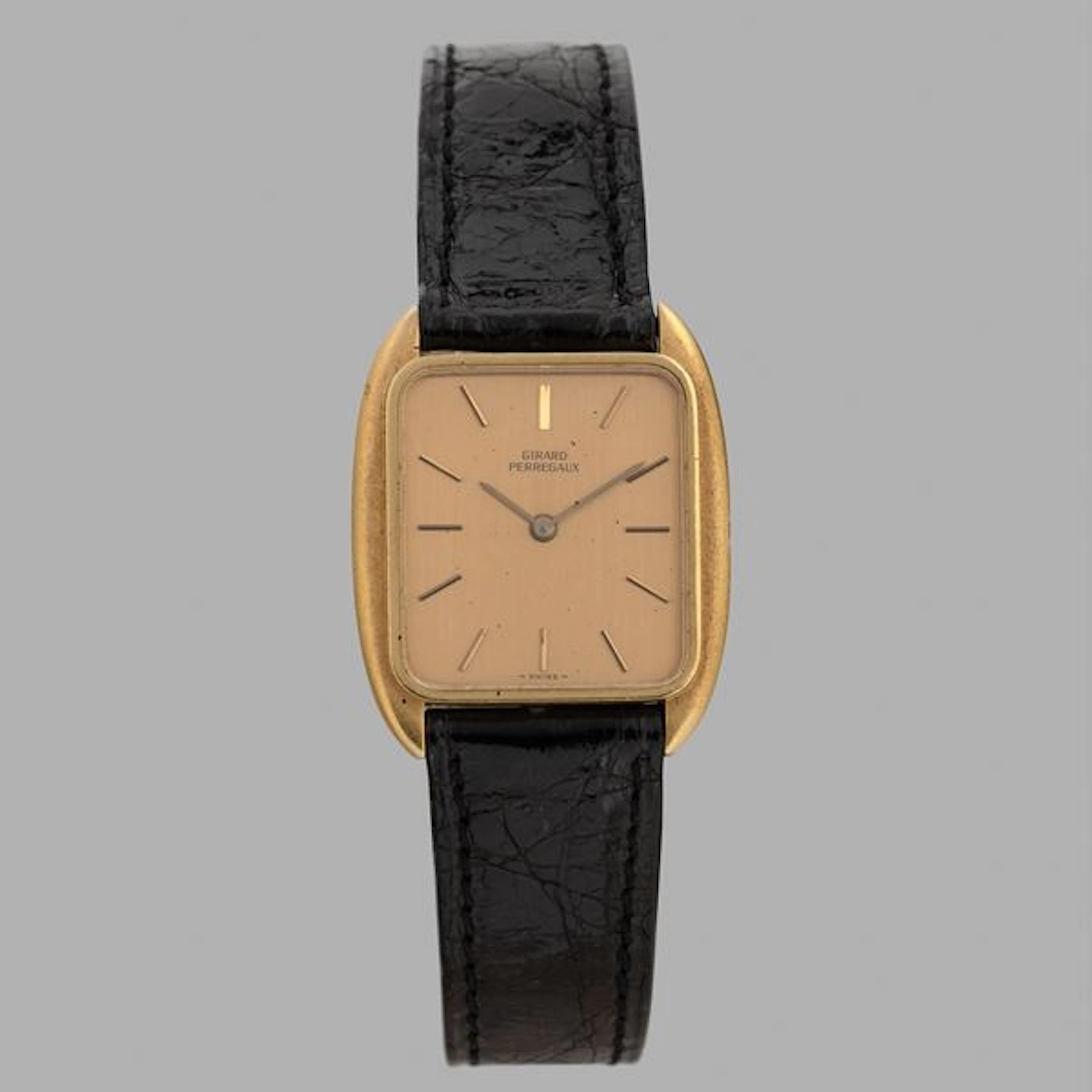 Tonneau in oro giallo 18k, quadrante champagne con indici applicati