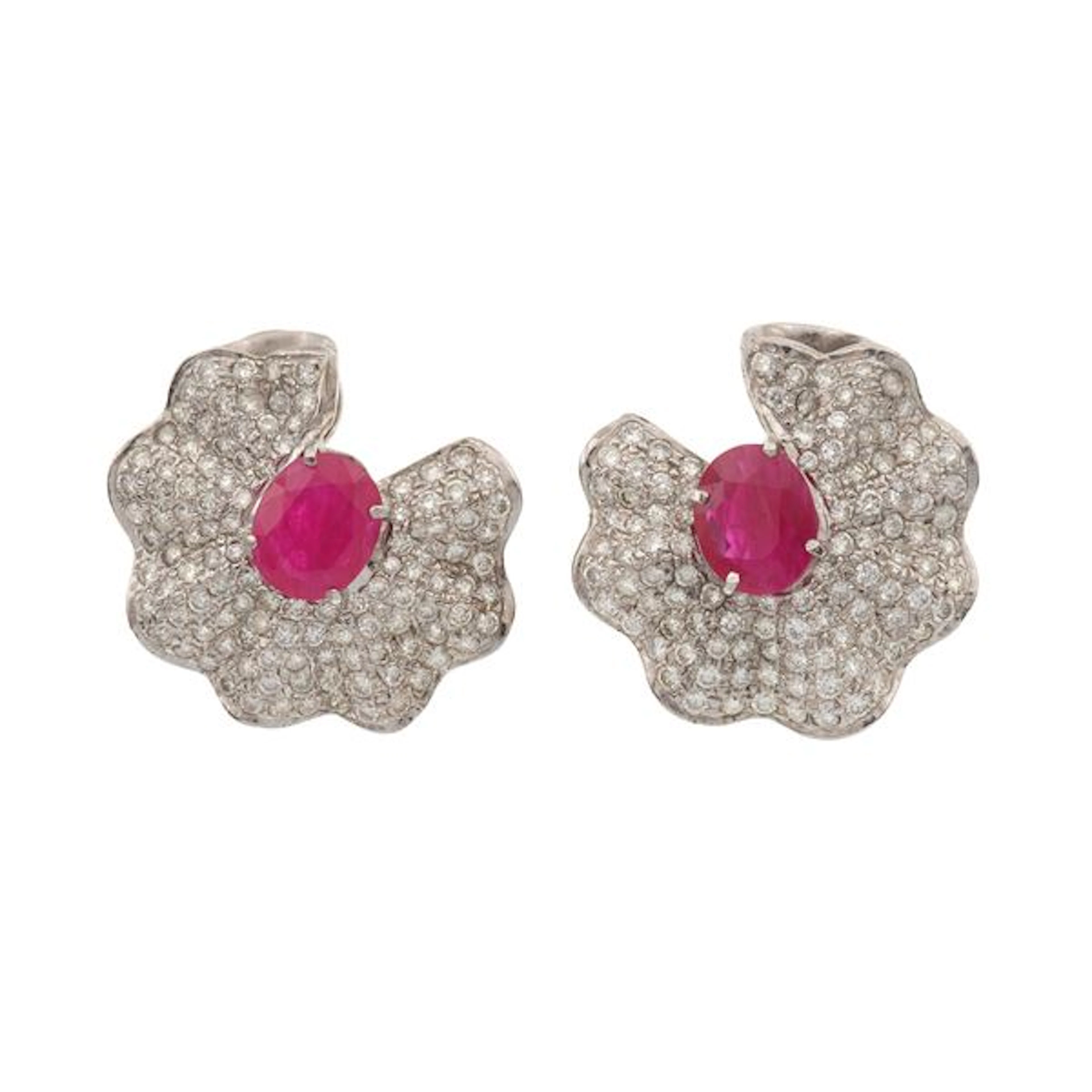 Pair of treatment ruby, diamond and gold earrings