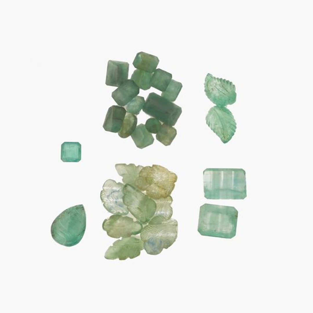 Collection of unmounted emeralds, of various shapes and treatments