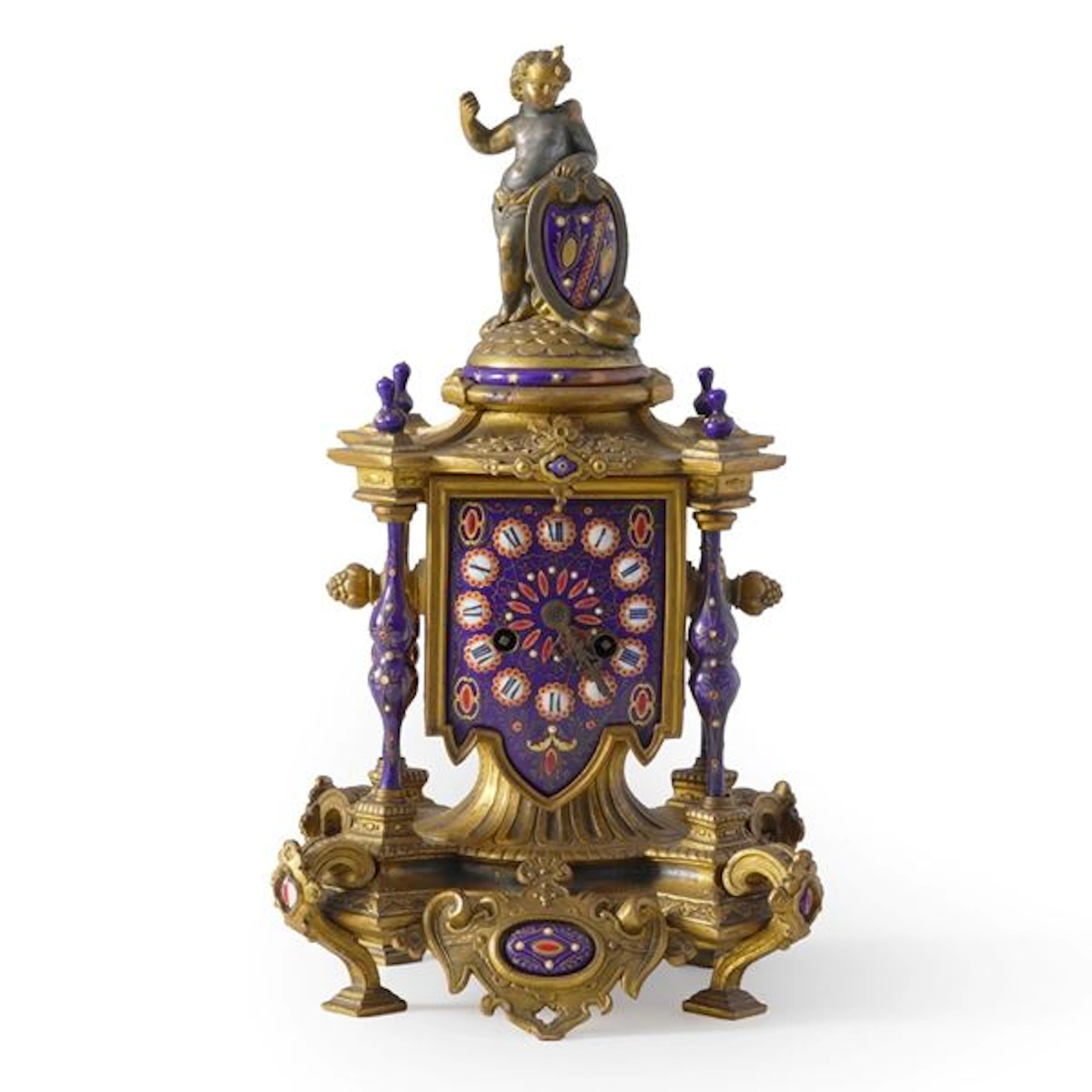 Orologio da tavolo in metallo dorato e smalti. XIX-XX secolo