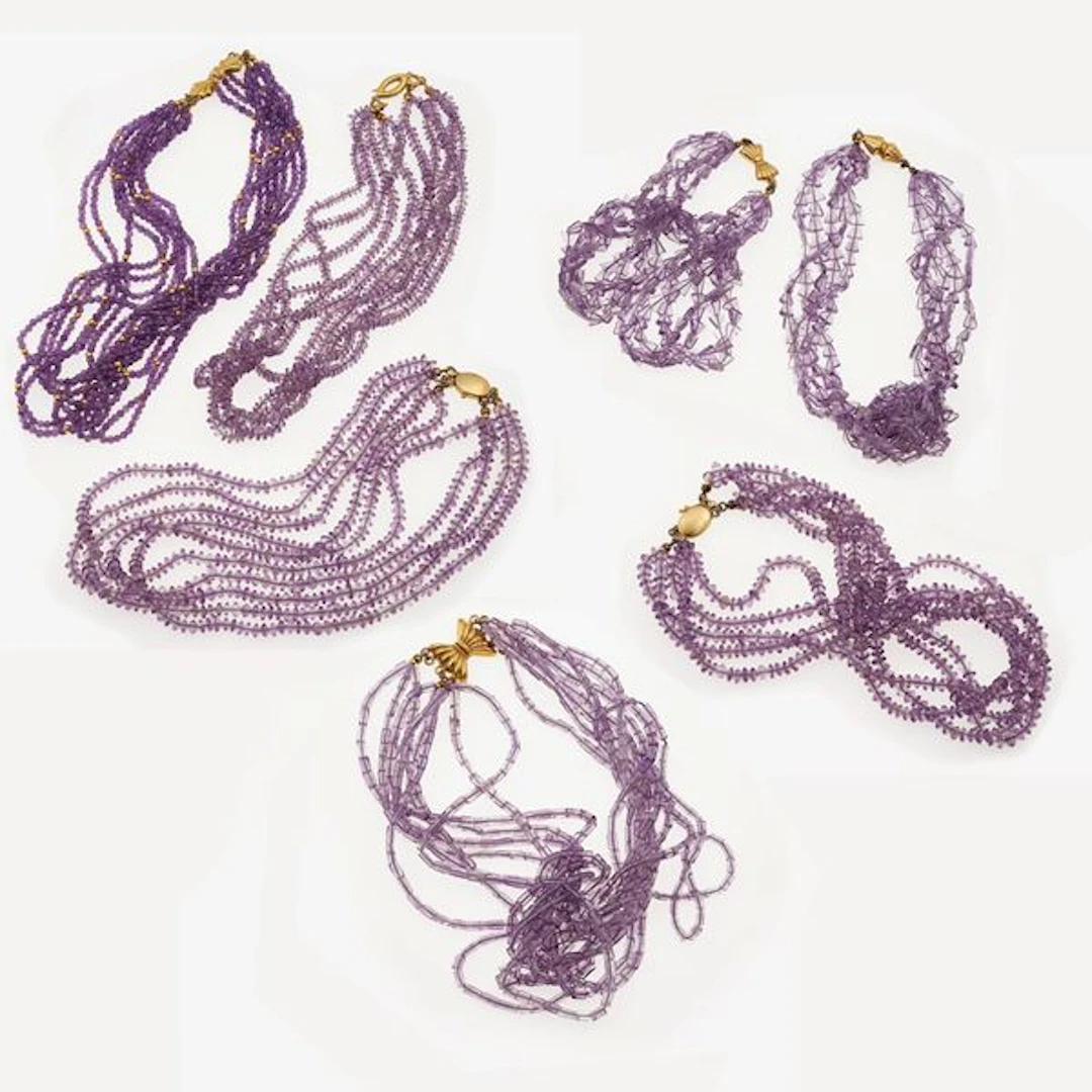 Seven amethyst and gold necklaces