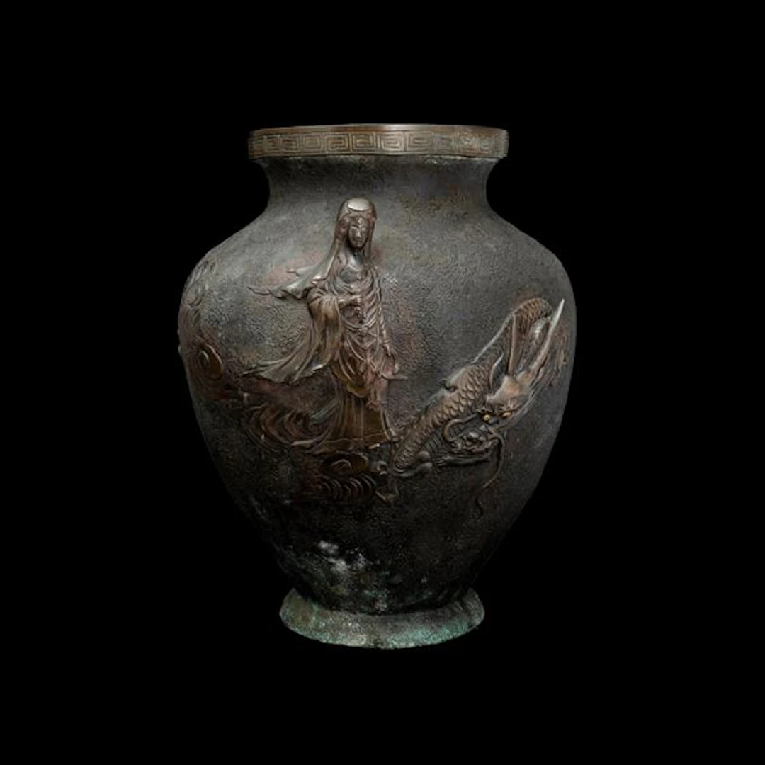 Bronze vase depicting Guanyin and dragon in relief with geometric