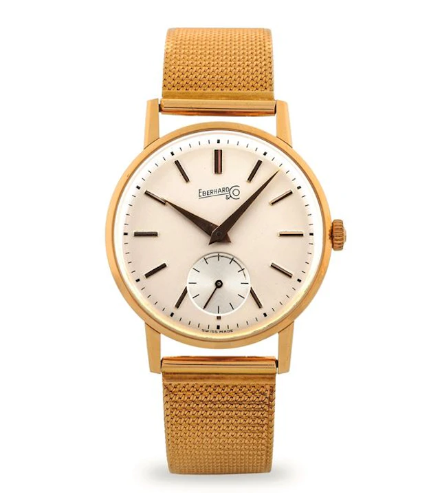 Elegant 18k yellow gold time only, opaline silver dial with seconds