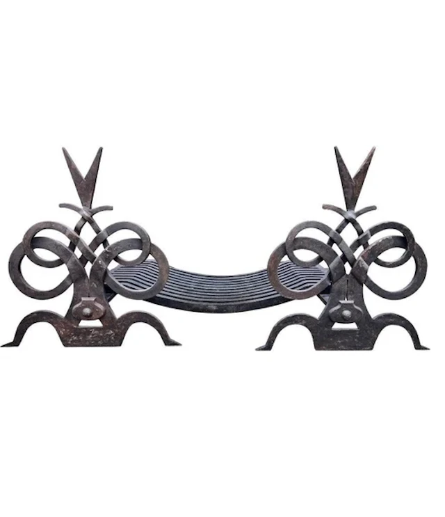 A pair of French hand forged wrought iron fire dogs in the style of