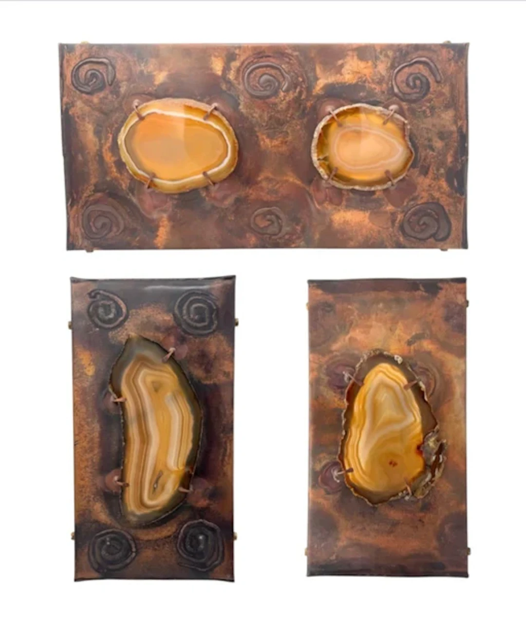 A set of three unusual 1970s copper and agate wall lights with one