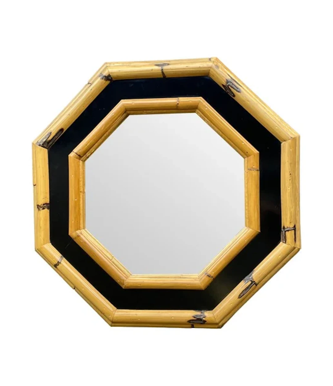 A 1970s Italian octagonal bamboo mirror with black laminated centre