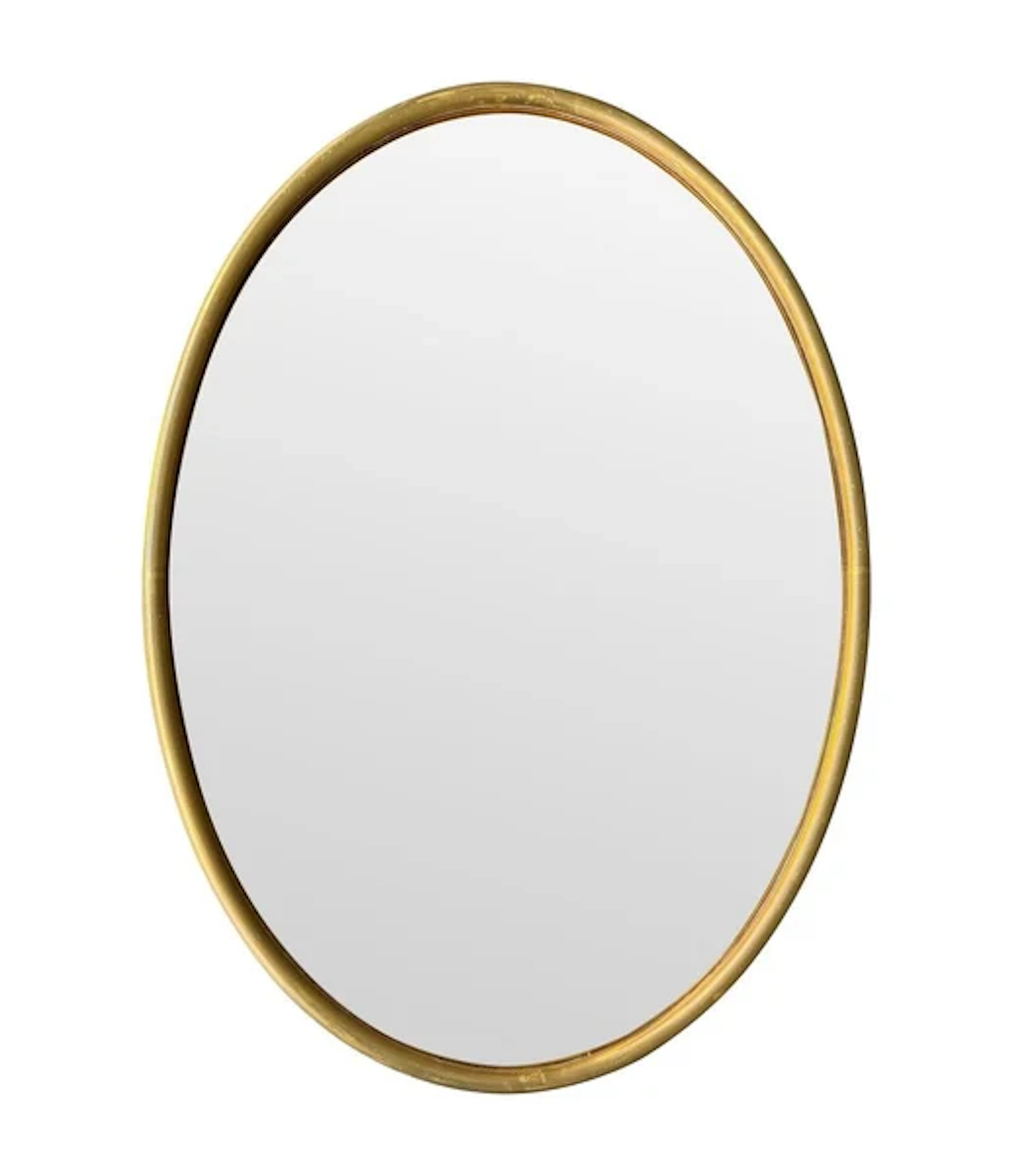 A large 1970s Italian brass framed oval mirror with bronzed mirror plate