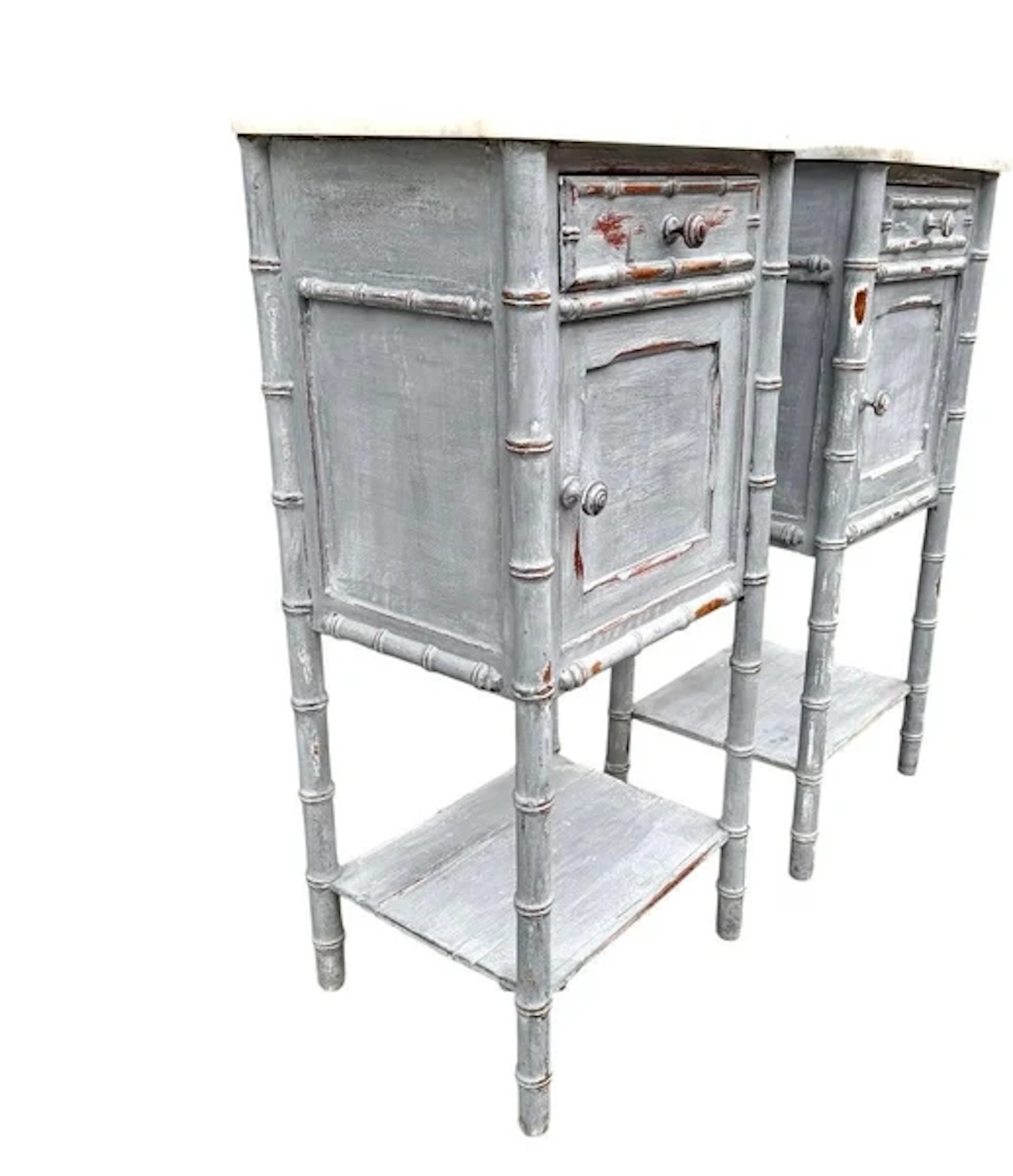 A pair of French 1930s faux bamboo painted wood and marble bedside tables