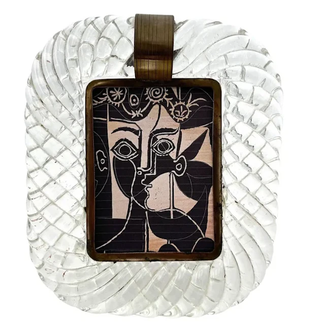 An orignal 1940s Murano torchon glass and brass framed mirror attributed