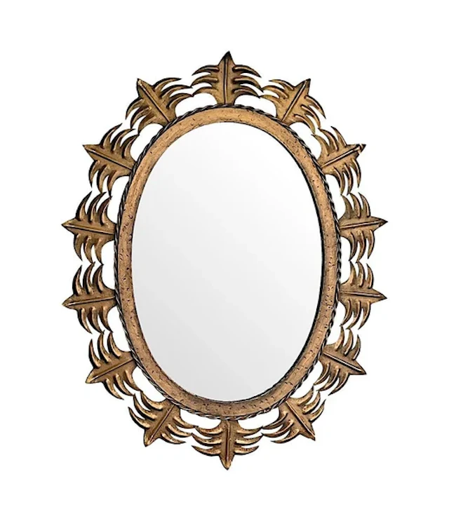 A Spanish 1950s gilt metal oval mirror with ornate edging