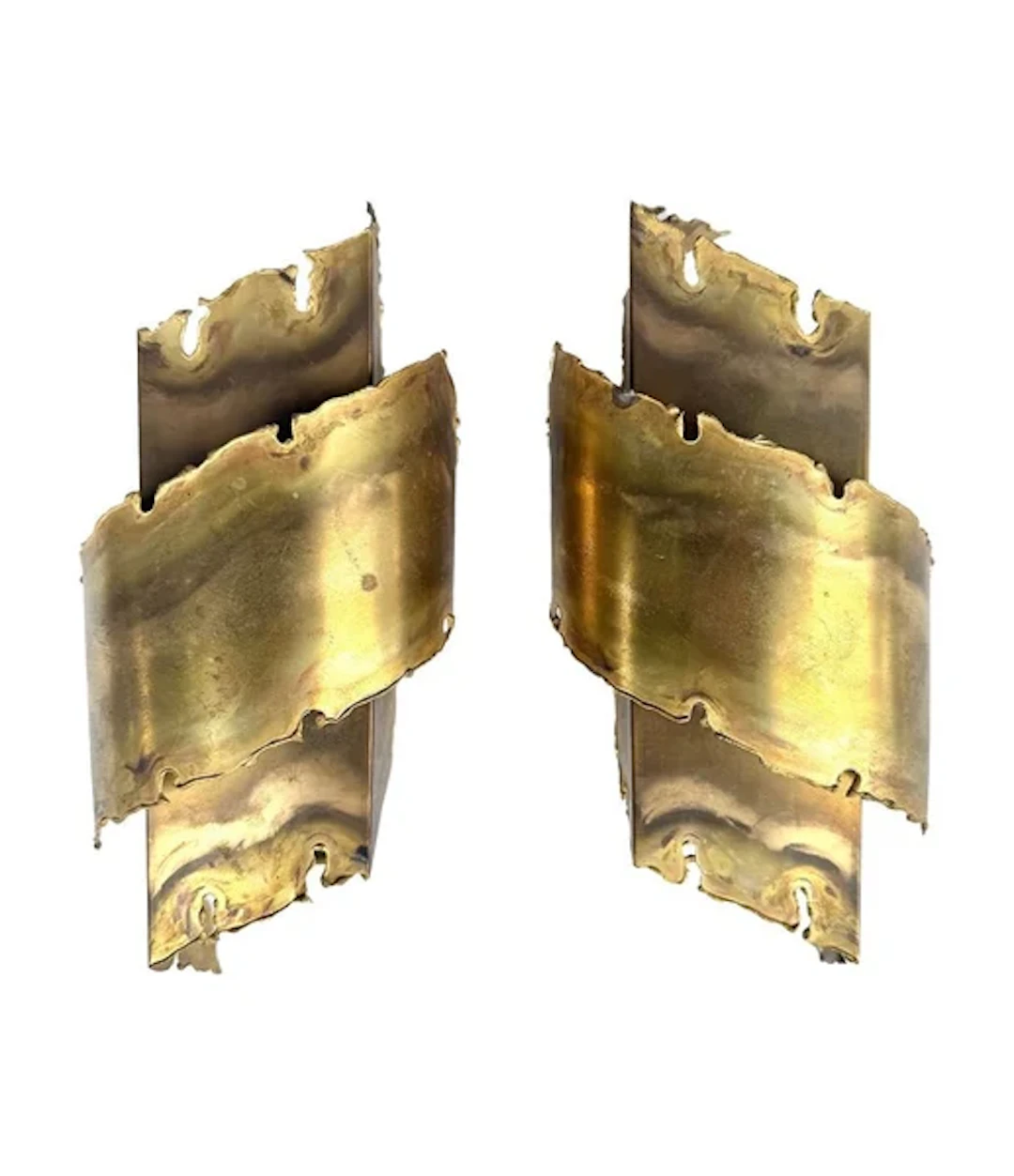 A pair of Danish 1960s torch cut brass wall sconces by Holm Sorensen.