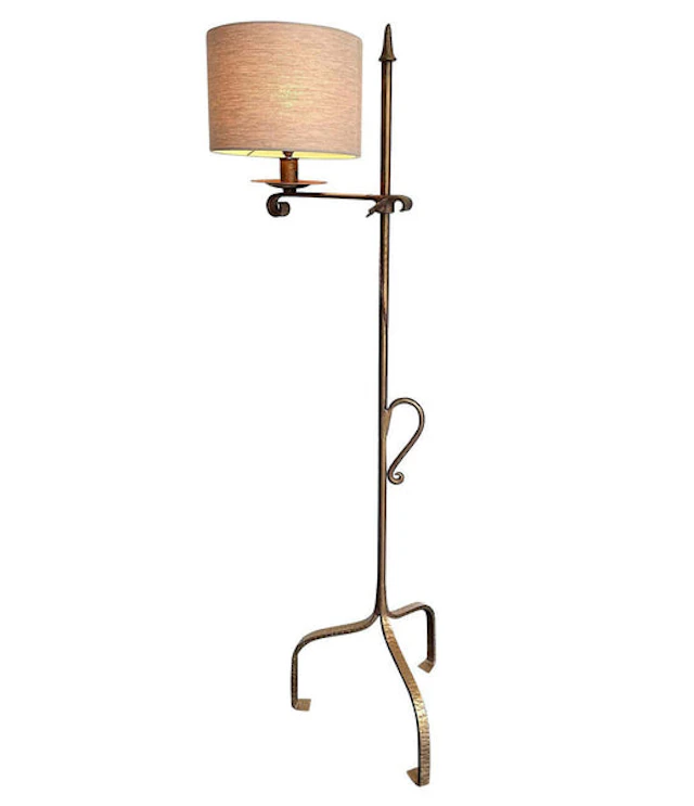 A 1950s Spanish gilt wrought iron, adjustable floor lamp with linen shade.