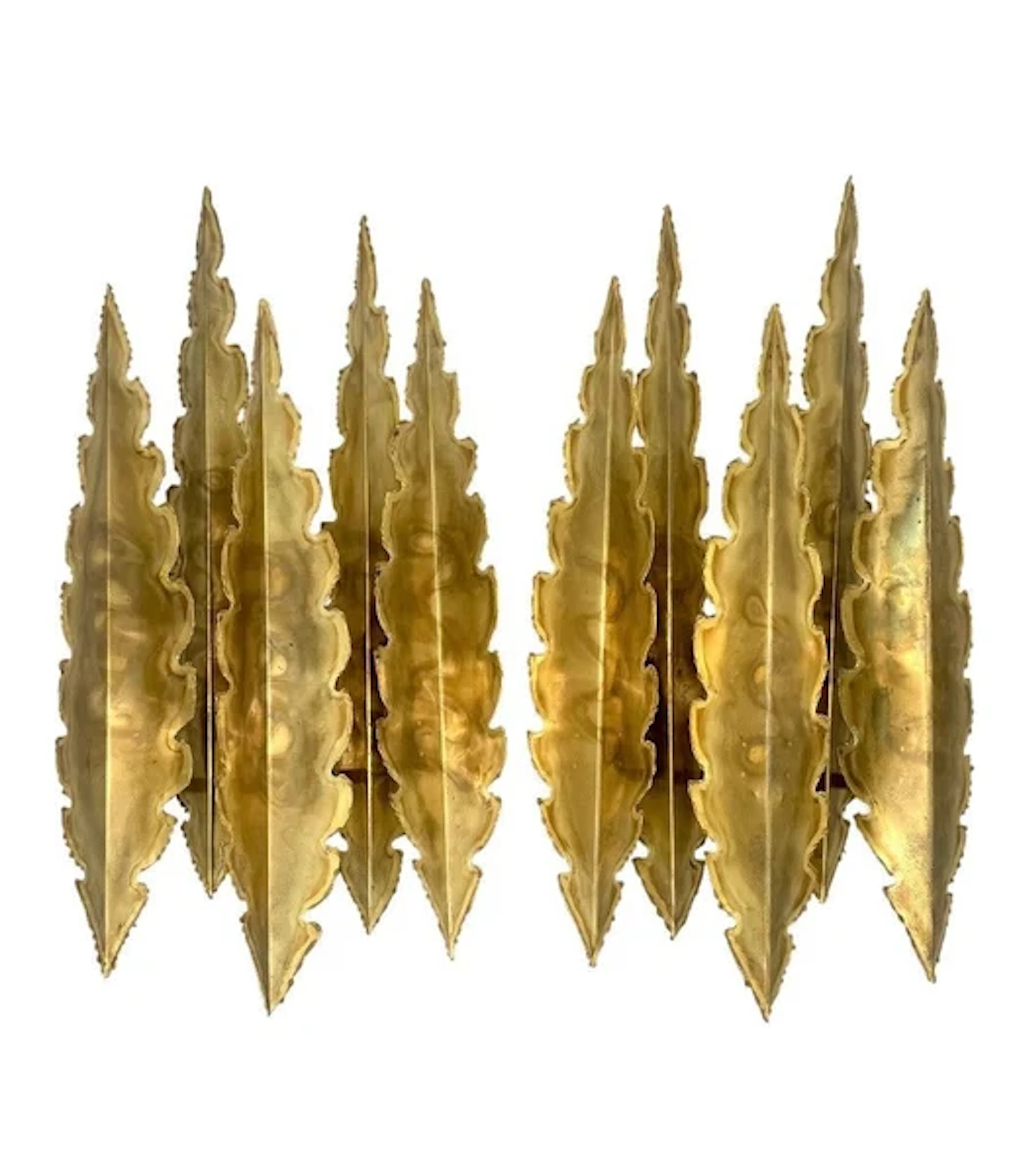A pair of large 1960s, 5 frond, torch cut brass wall sconces by Holm Sorensen.