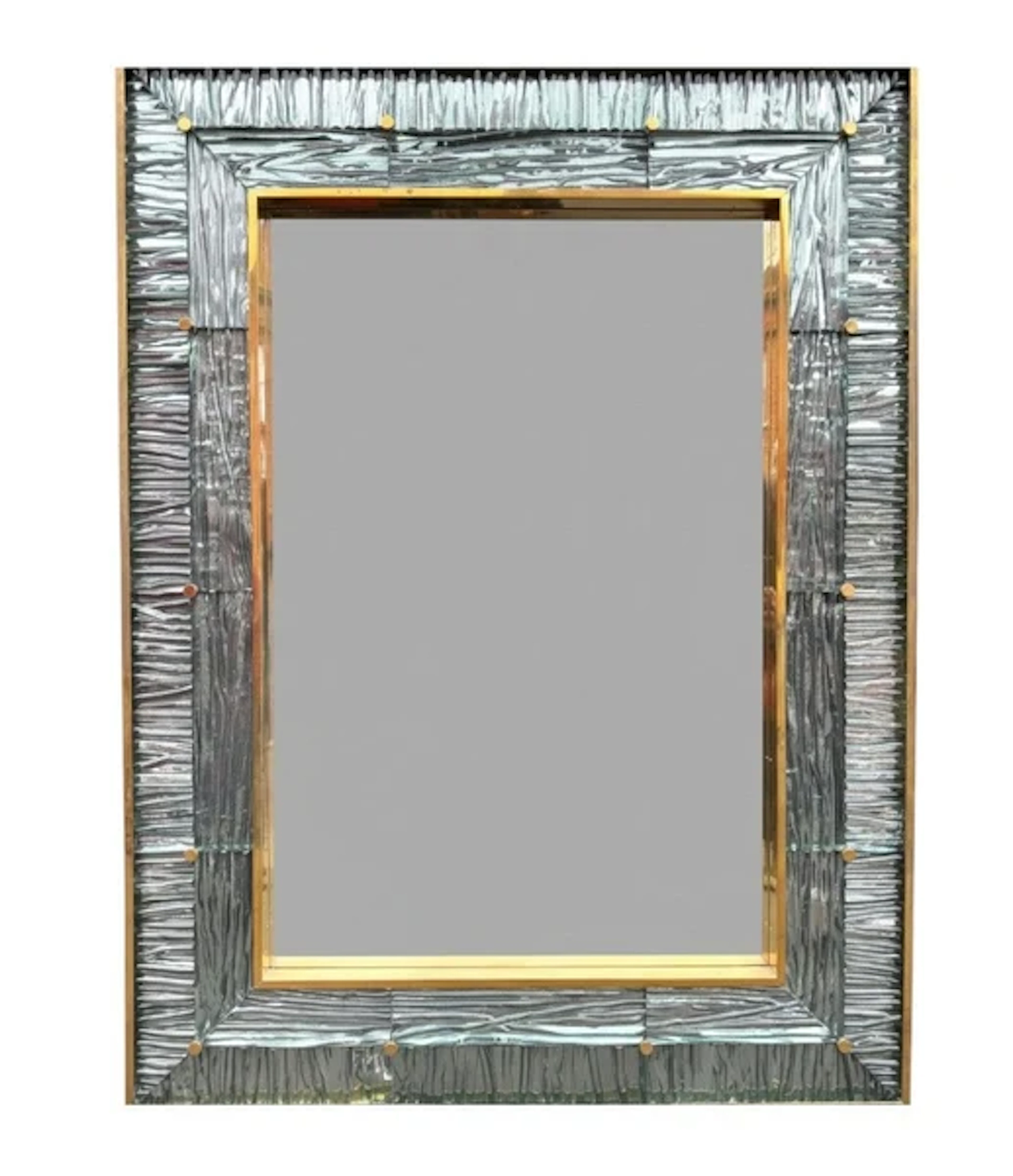 A large orignal Italian 1970s solid brass mirror with blue Murano glass frame