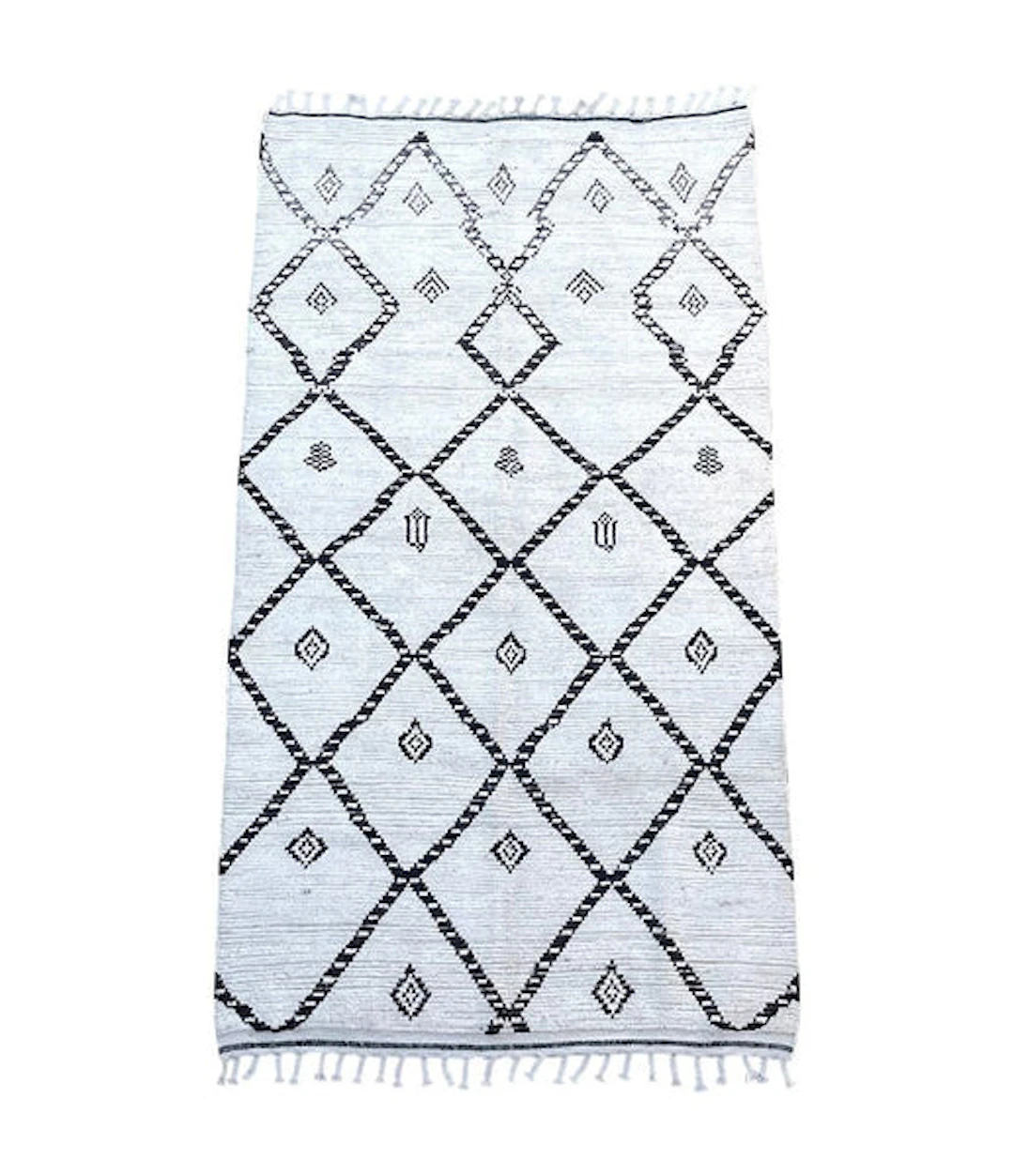 A vintage handwoven Moroccan berber rug with tribal diamond and line pattern
