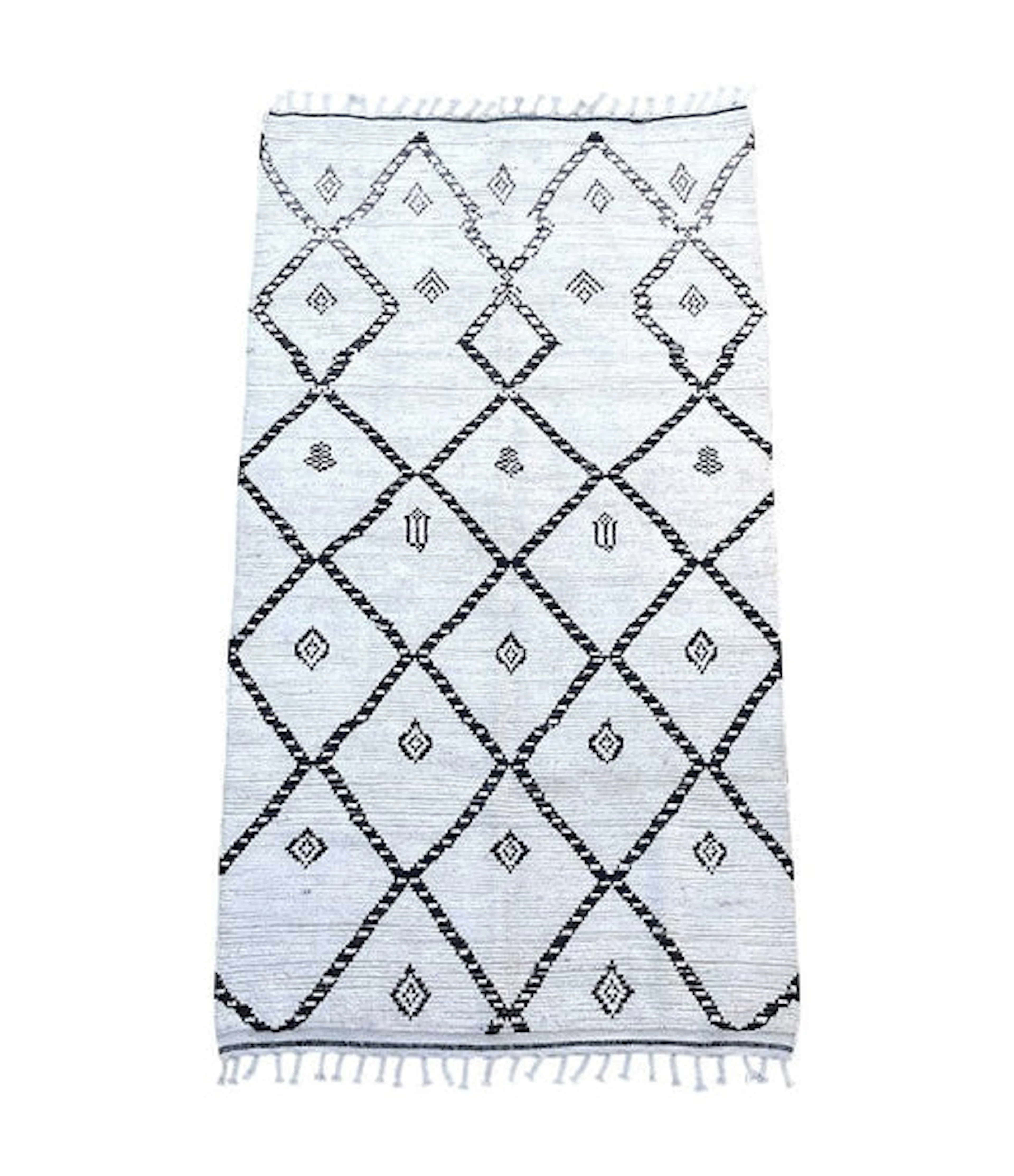 A vintage handwoven Moroccan berber rug with tribal diamond and line pattern