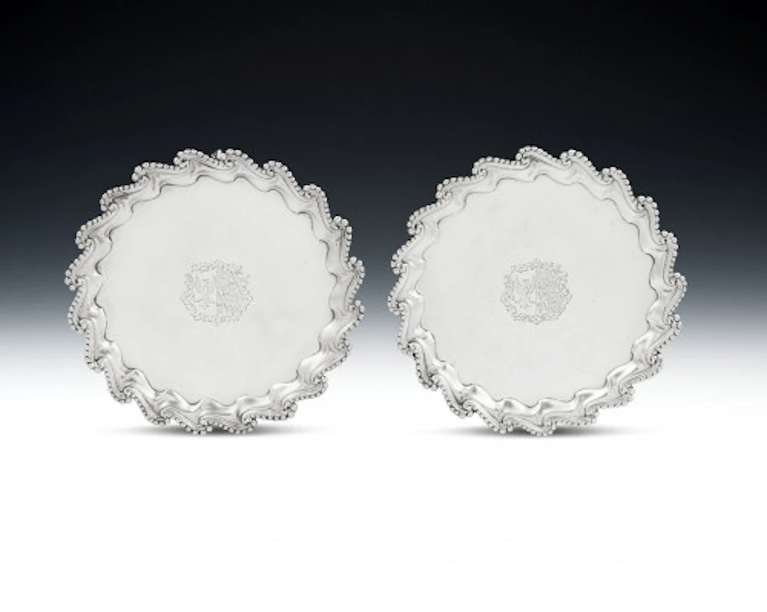 A very unusual pair of George III Salvers made in London in 1766 by