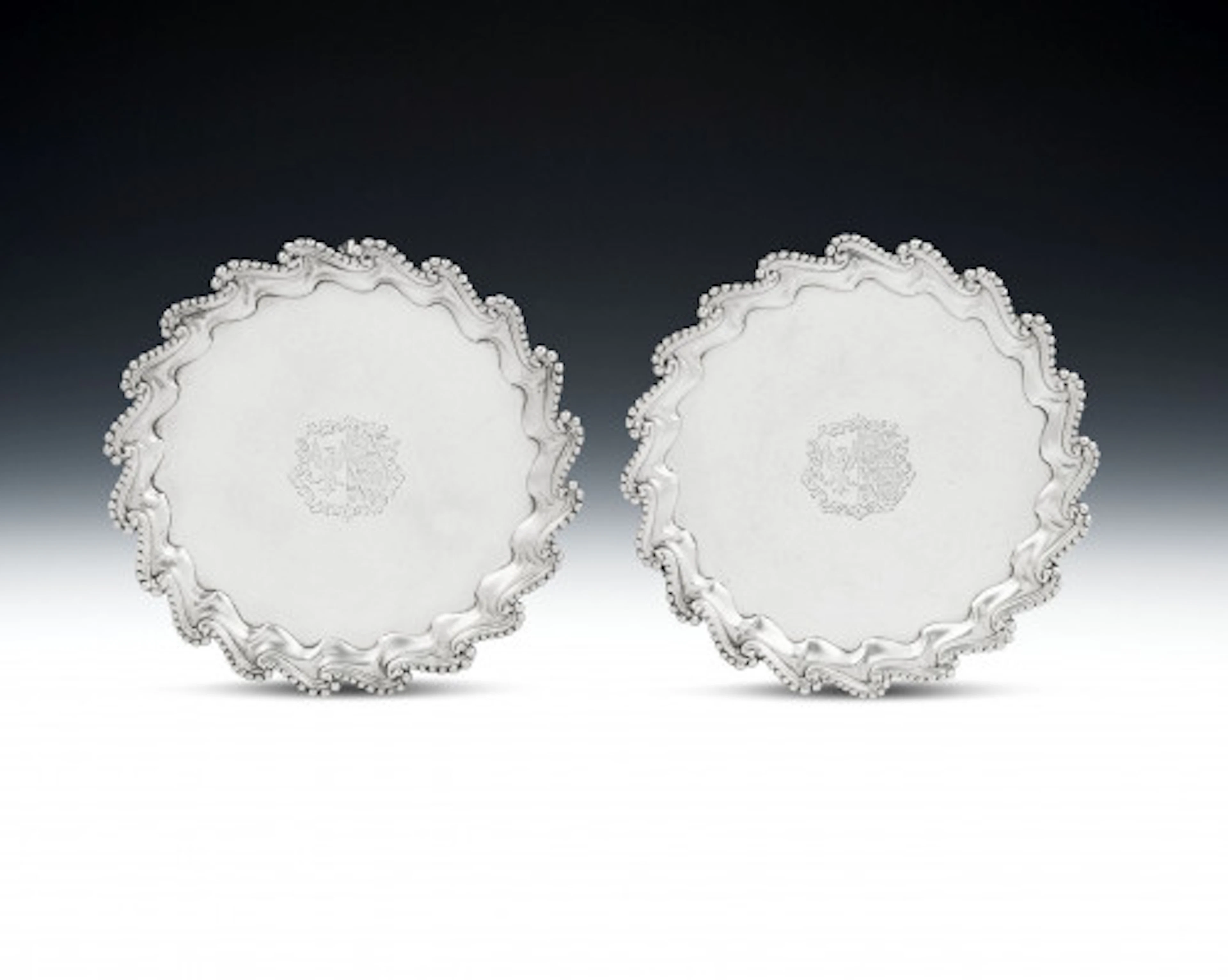 A very unusual pair of George III Salvers made in London in 1766 by