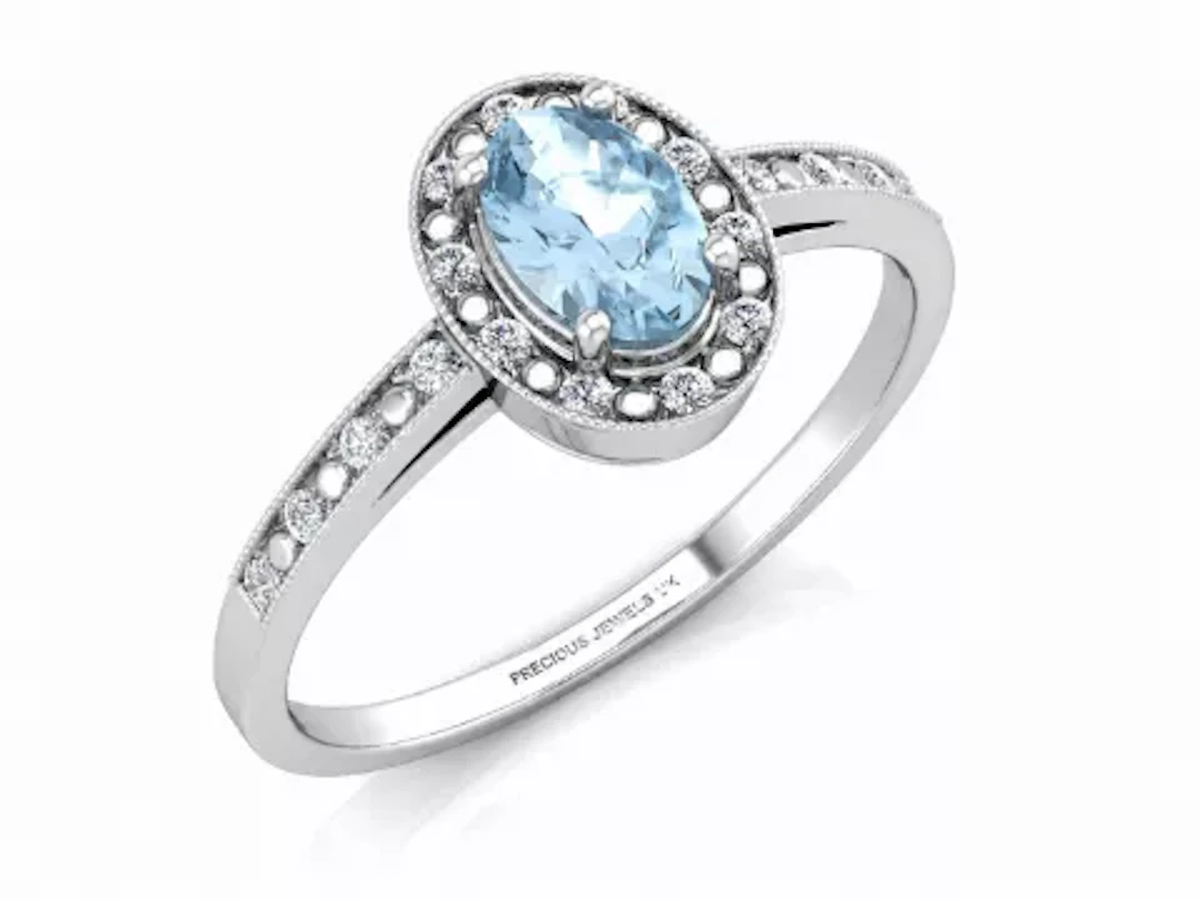 9ct White Gold Oval Cluster Diamond And Blue Topaz Ring (BT0.58) 0.09 Carats