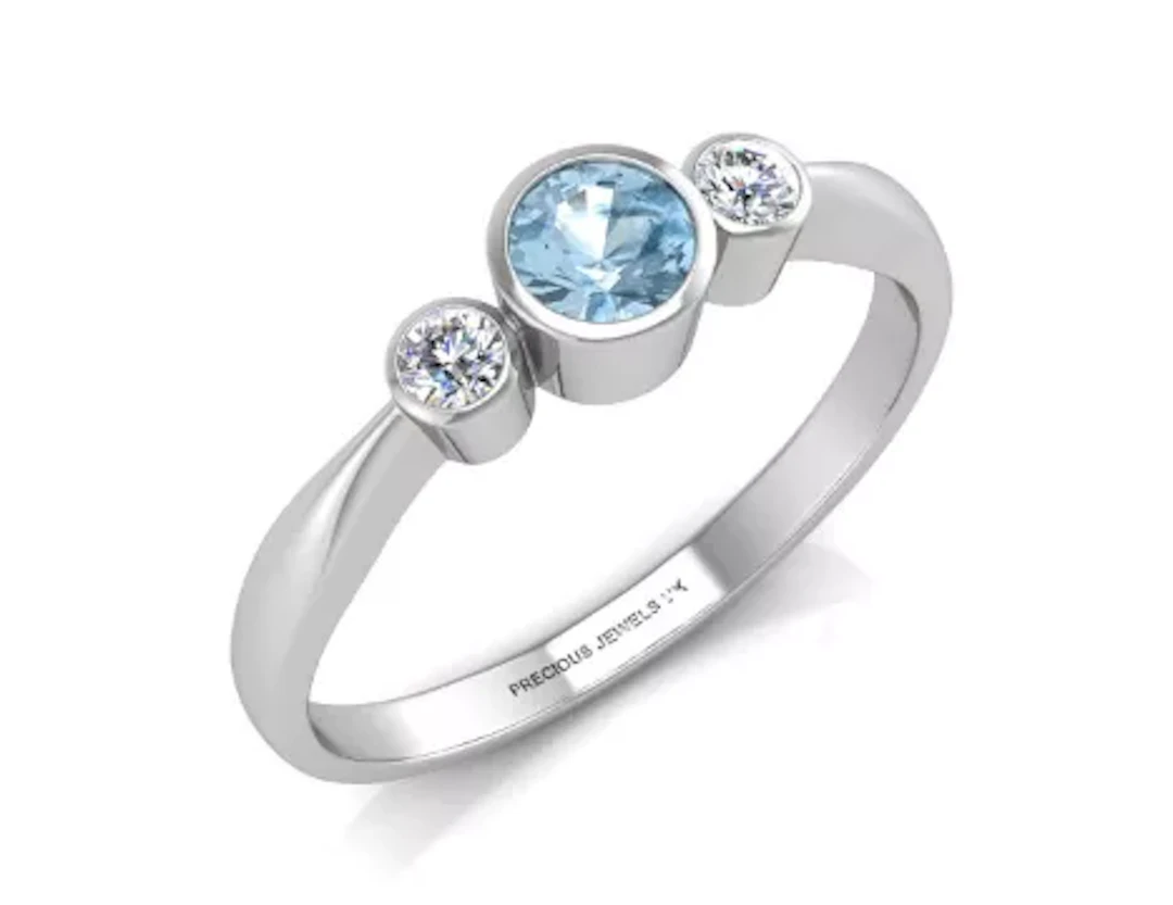 9ct White Gold Three Stone Diamond And Blue Topaz Ring (BT0.35) 0.10 Carats