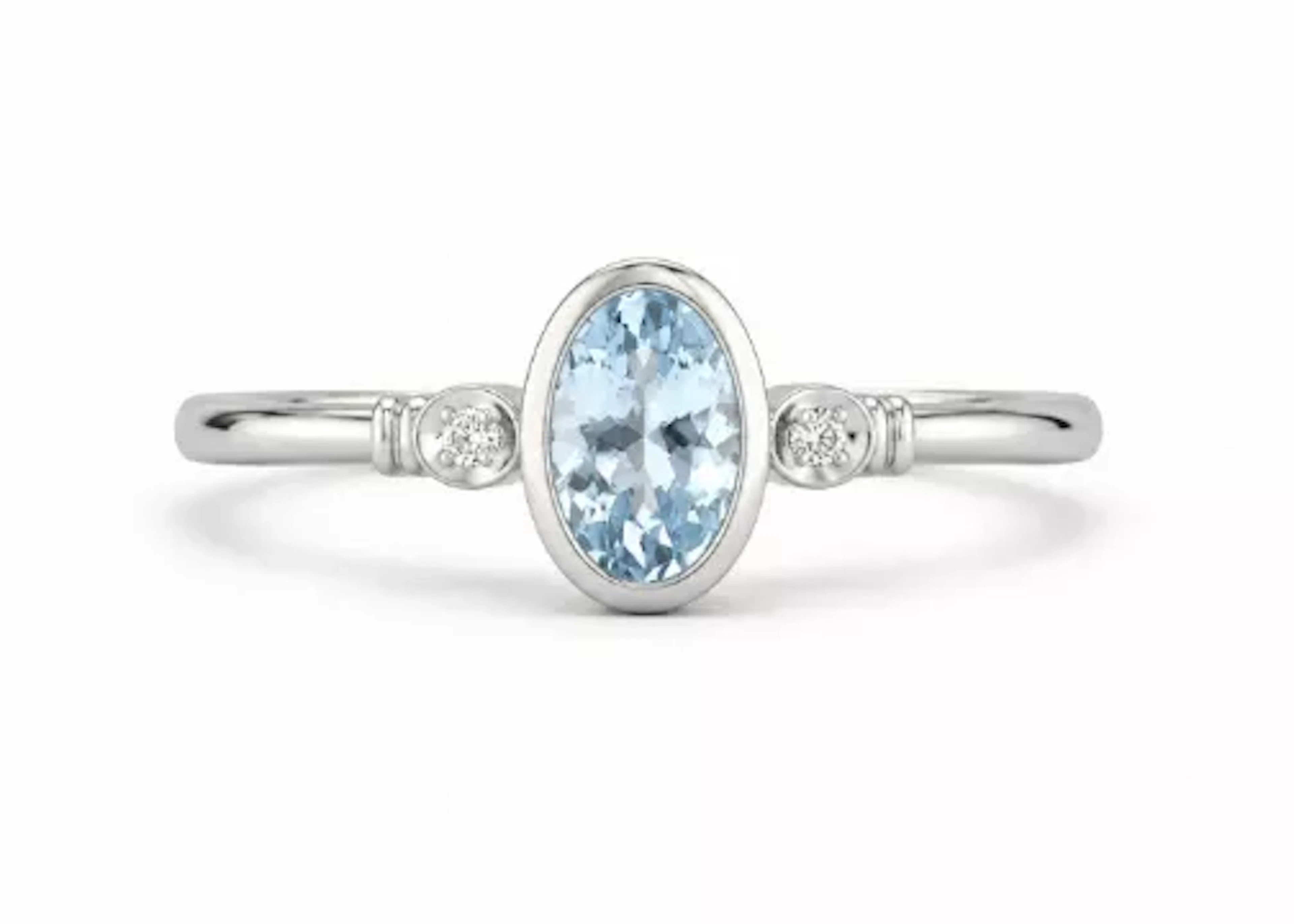 9ct White Gold Diamond And Oval Shape Blue Topaz Ring