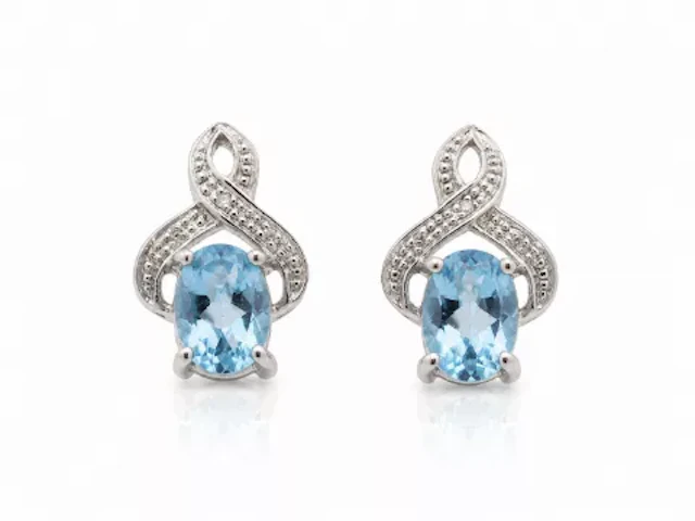 9ct White Gold Diamond And Blue Topaz Earrings