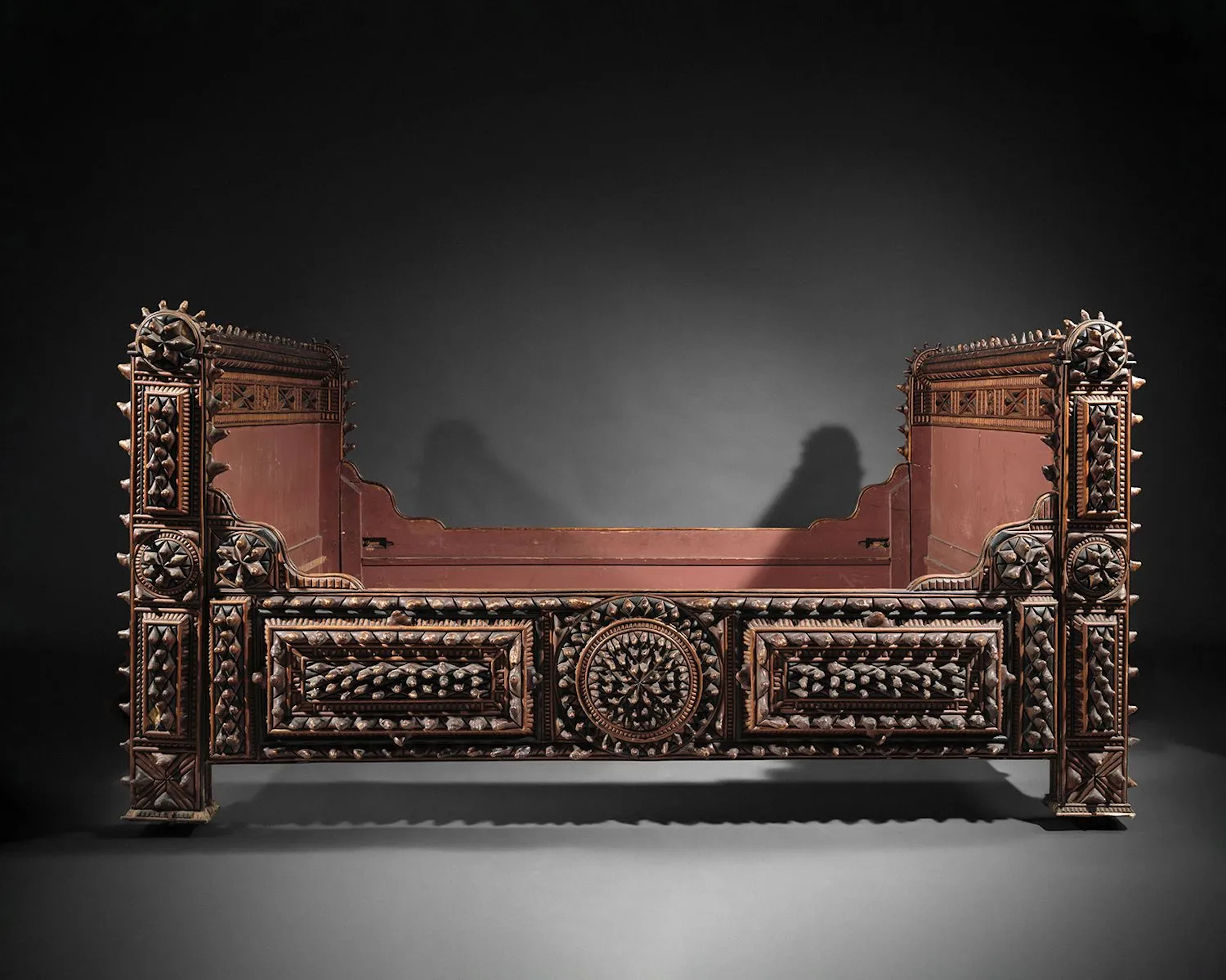 A set of richly carved wooden bedroom furniture featuring ro - Lot 60