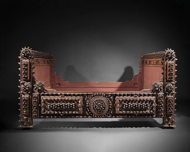 A set of richly carved wooden bedroom furniture featuring ro - Lot 60
