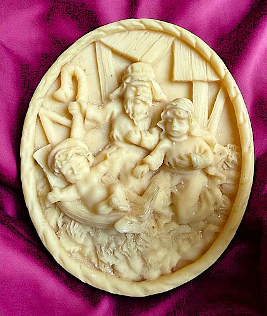 A DIVISION THREE CARVED MATERIAL SCENE BUTTON