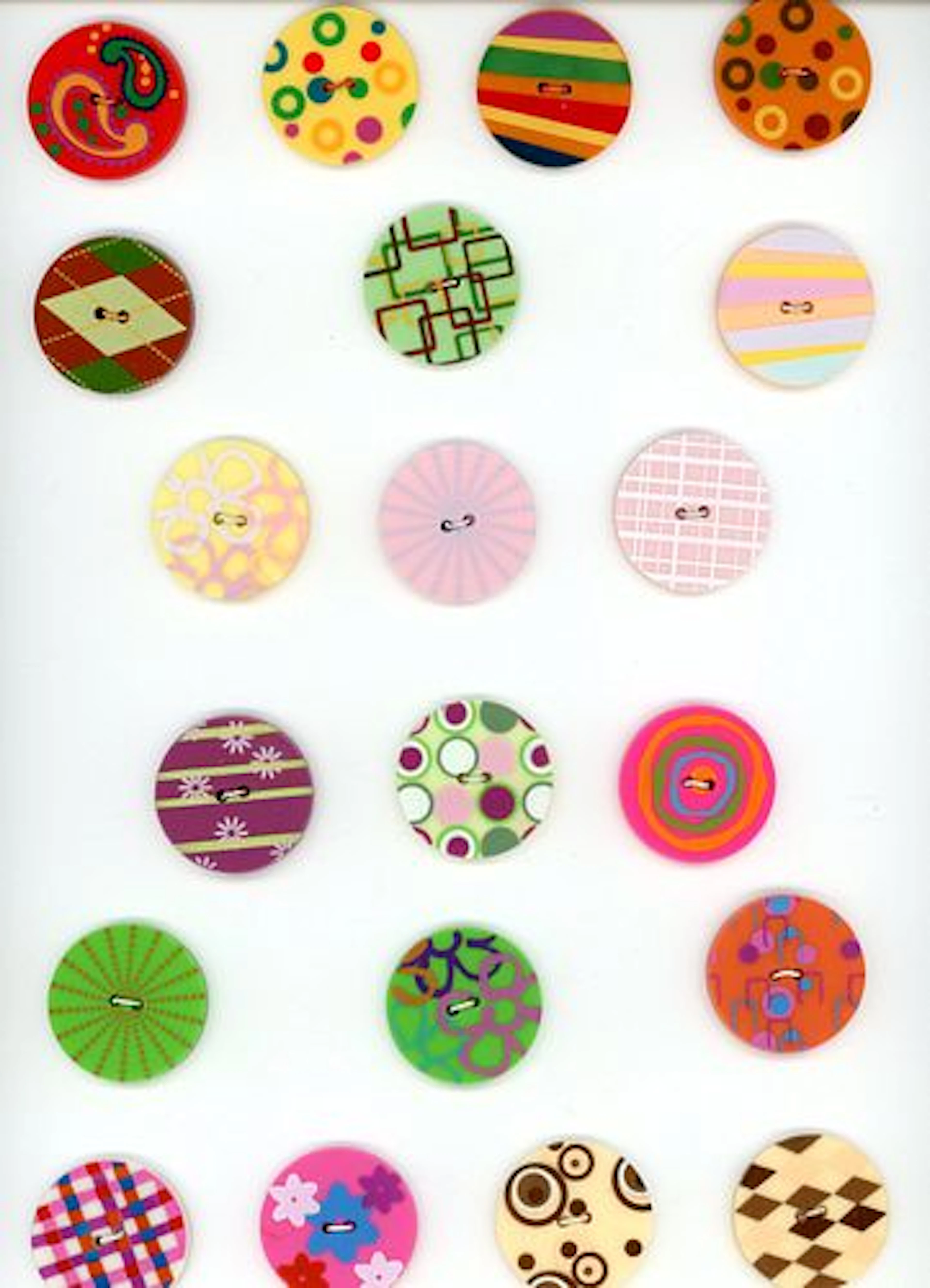 A CARD OF DIVISION THREE COLORFUL PLASTIC BUTTONS