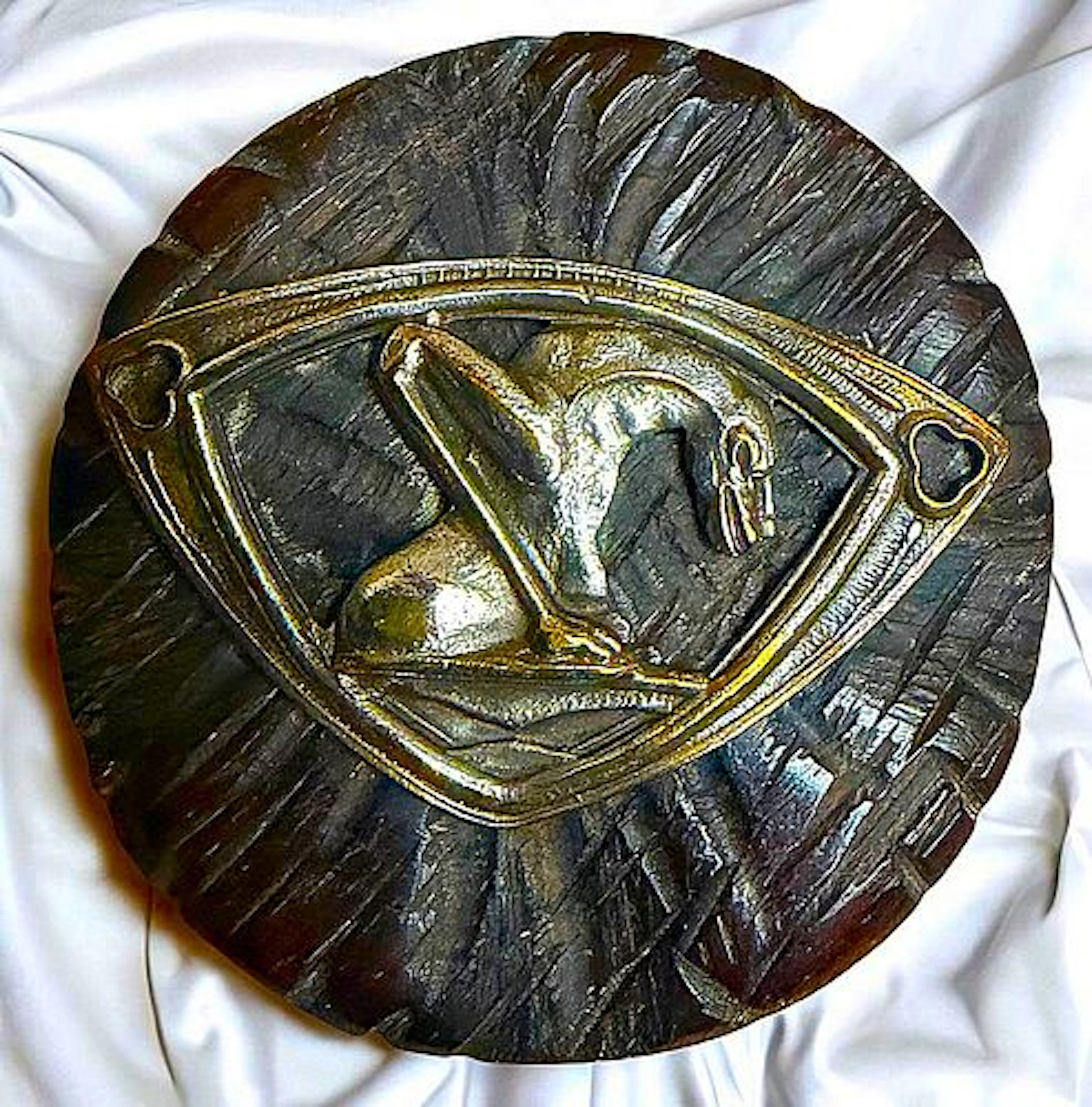 A DIVISION ONE BRASS ESCUTCHEONED WOOD BUTTON