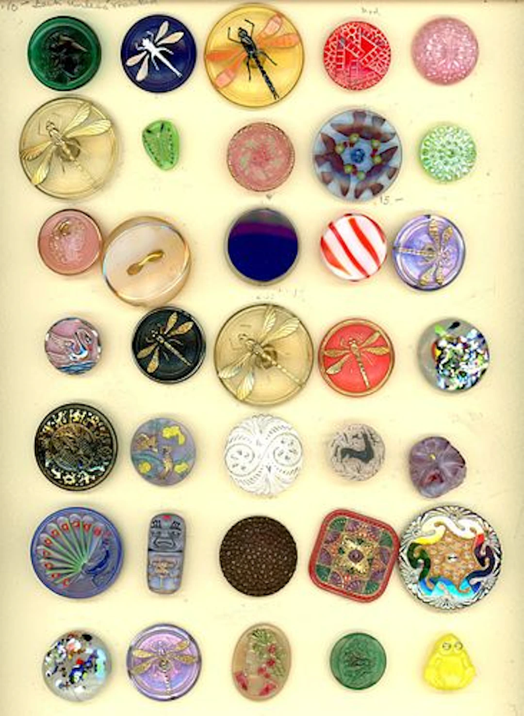 A CARD OF DIVISION THREE ASSORTED CZECH GLASS BUTTONS