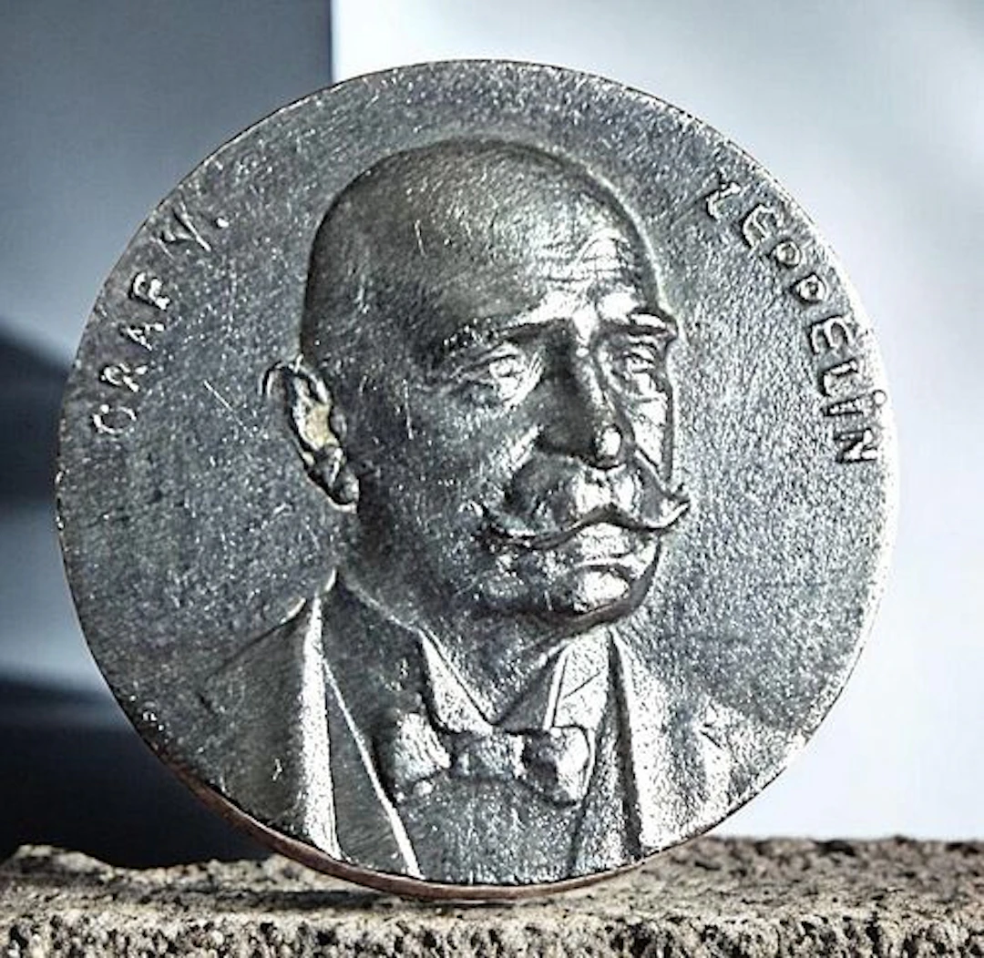 A DIVISION ONE THIRD AVENUE SILVER BUTTON