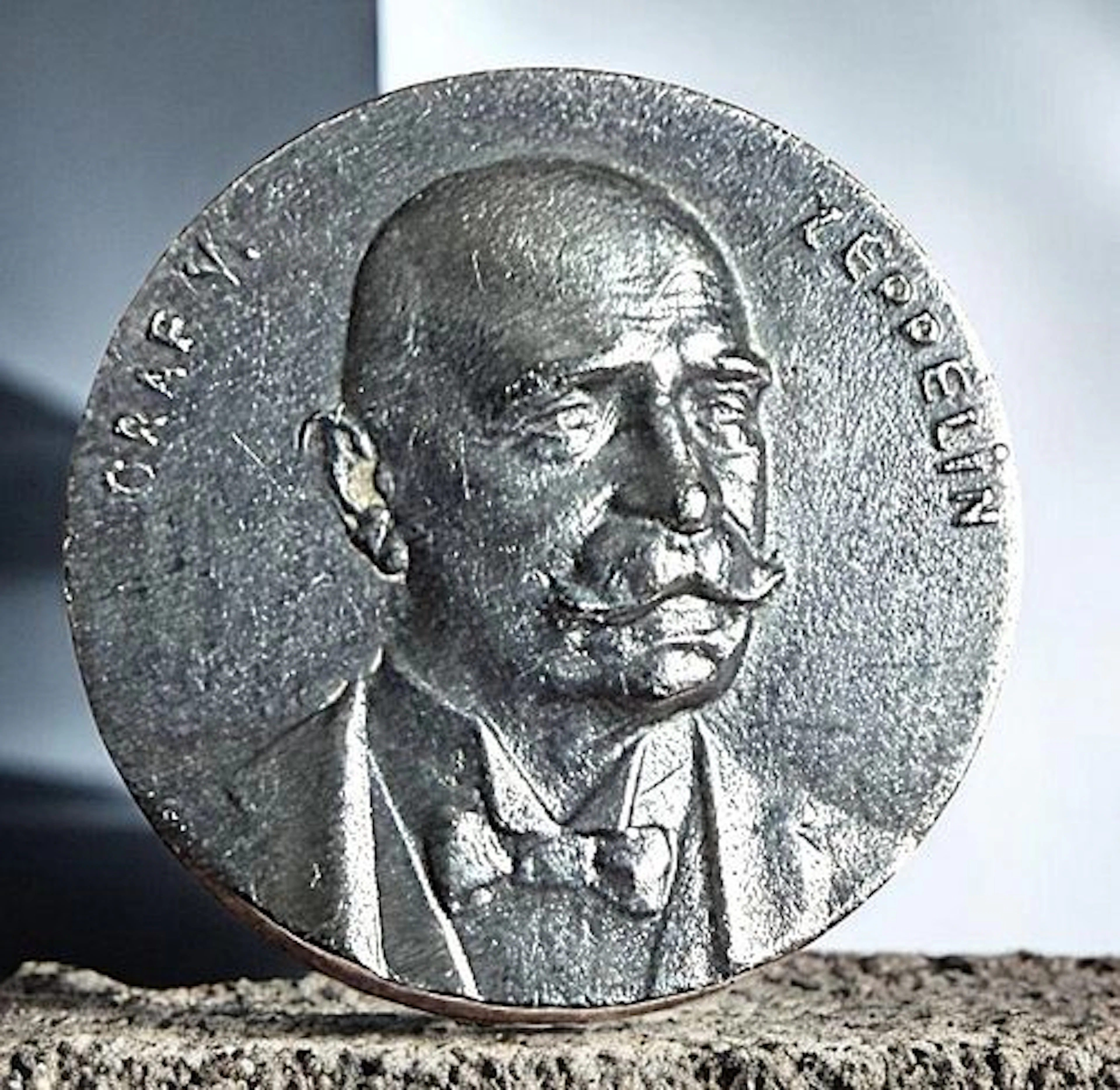 A DIVISION ONE THIRD AVENUE SILVER BUTTON