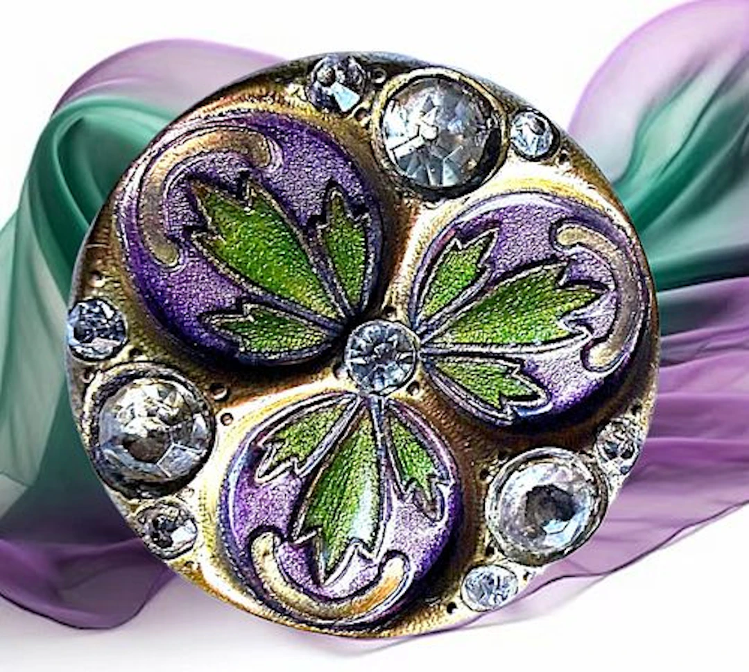 A DIVISION ONE ENAMEL AND JEWELED BUTTON