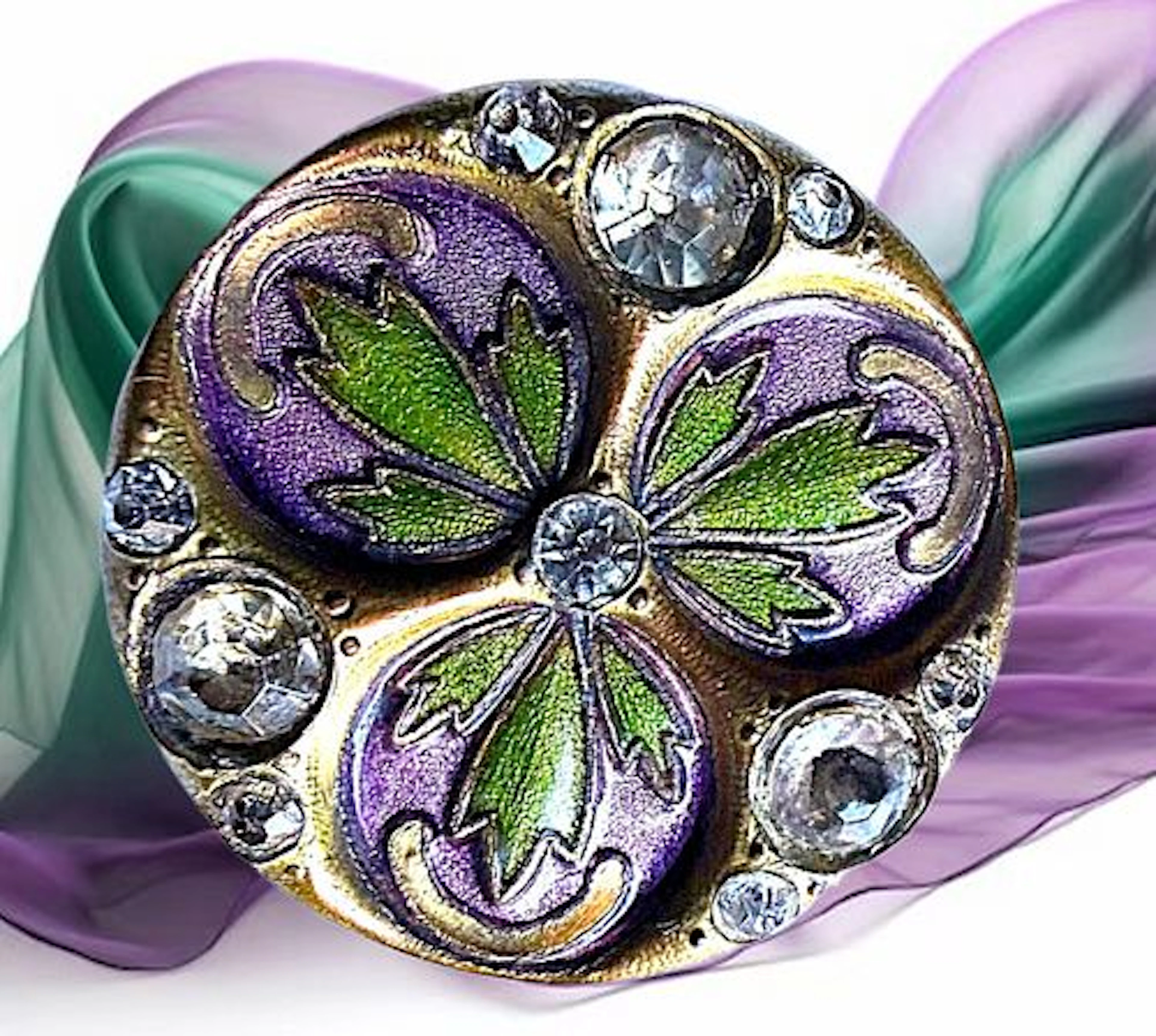 A DIVISION ONE ENAMEL AND JEWELED BUTTON